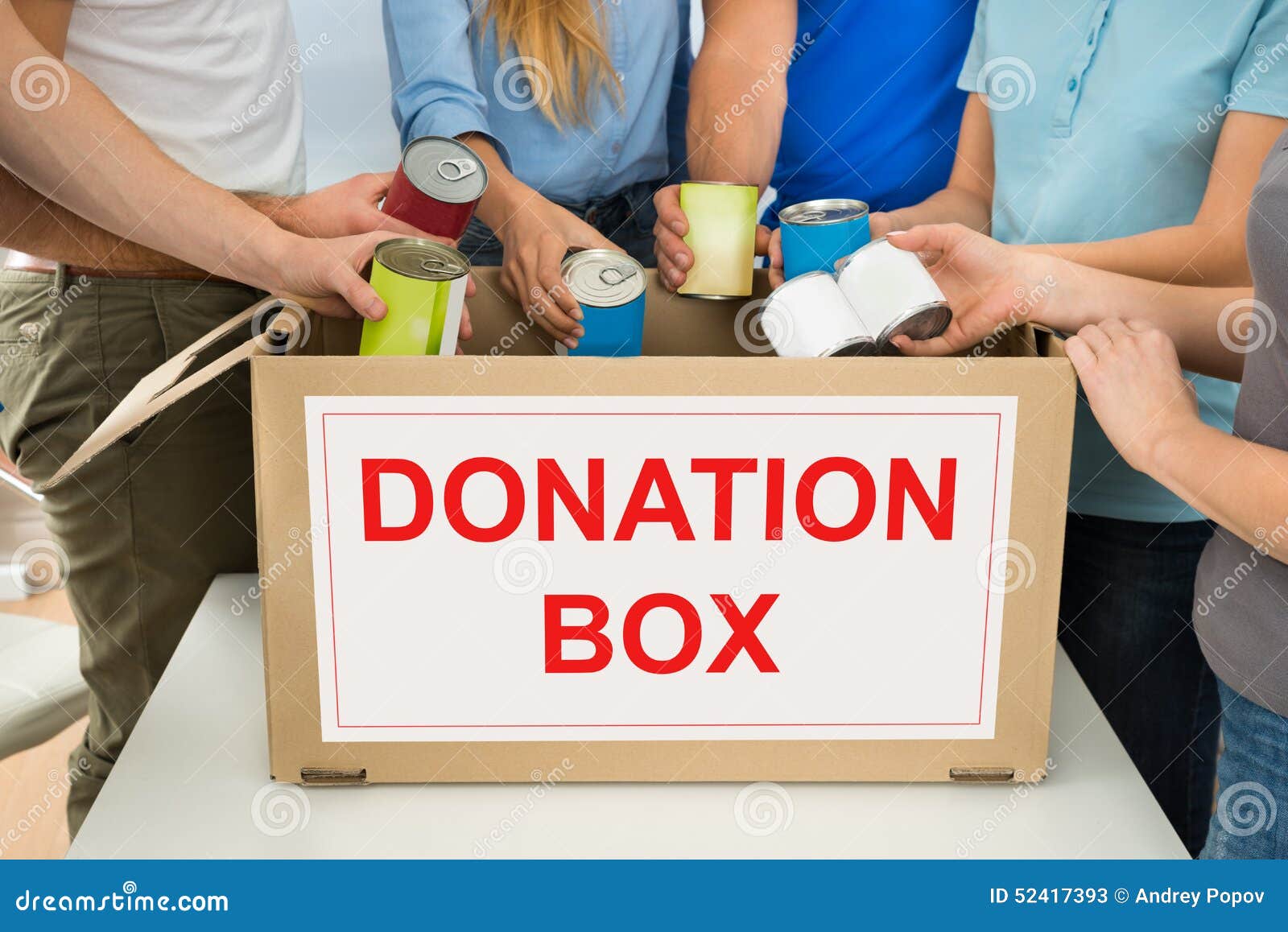 People with Donation Box Holding Cans Stock Image Image of holding