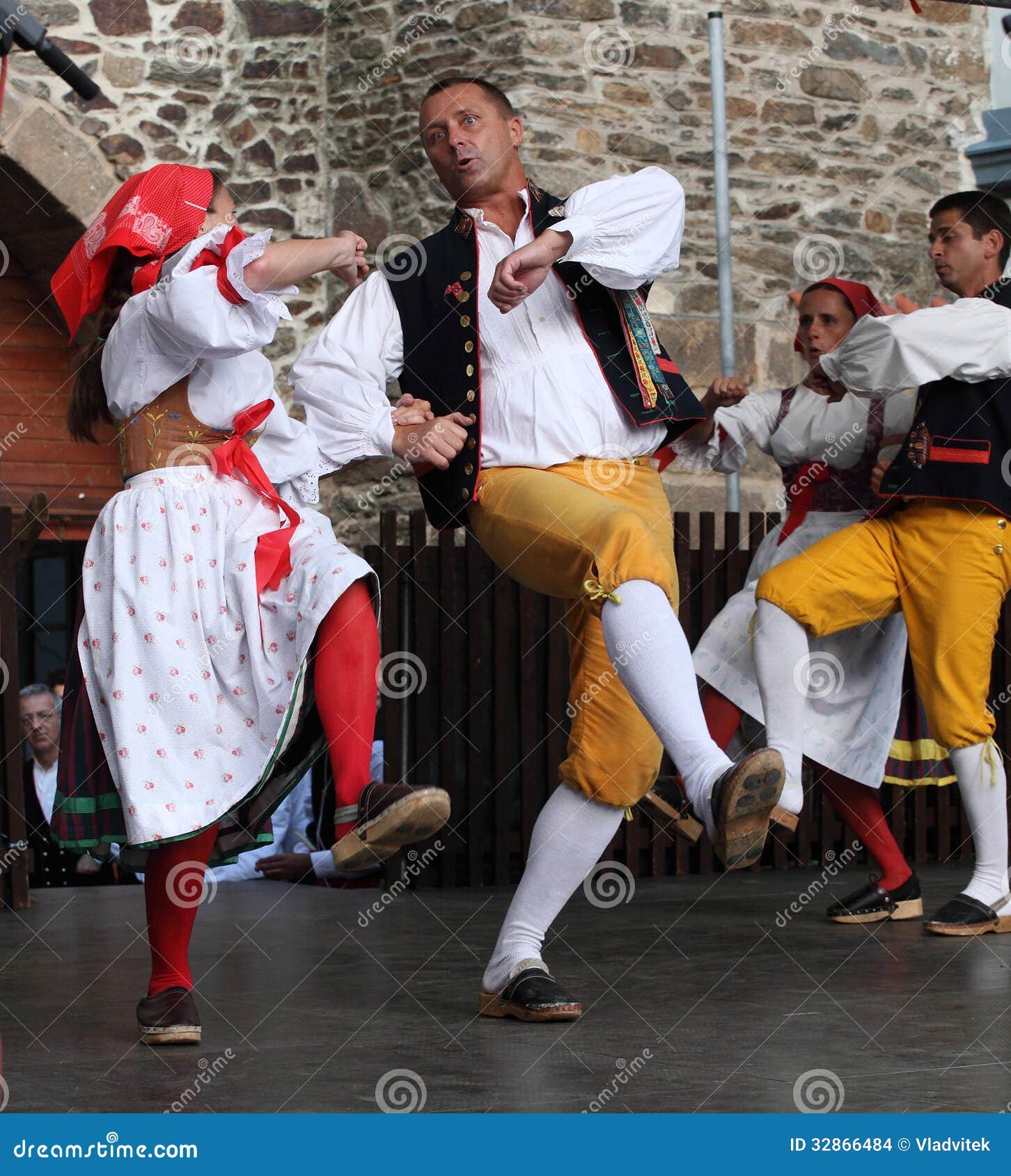 People Dressed In Czech Traditional Garb Dancing And ...