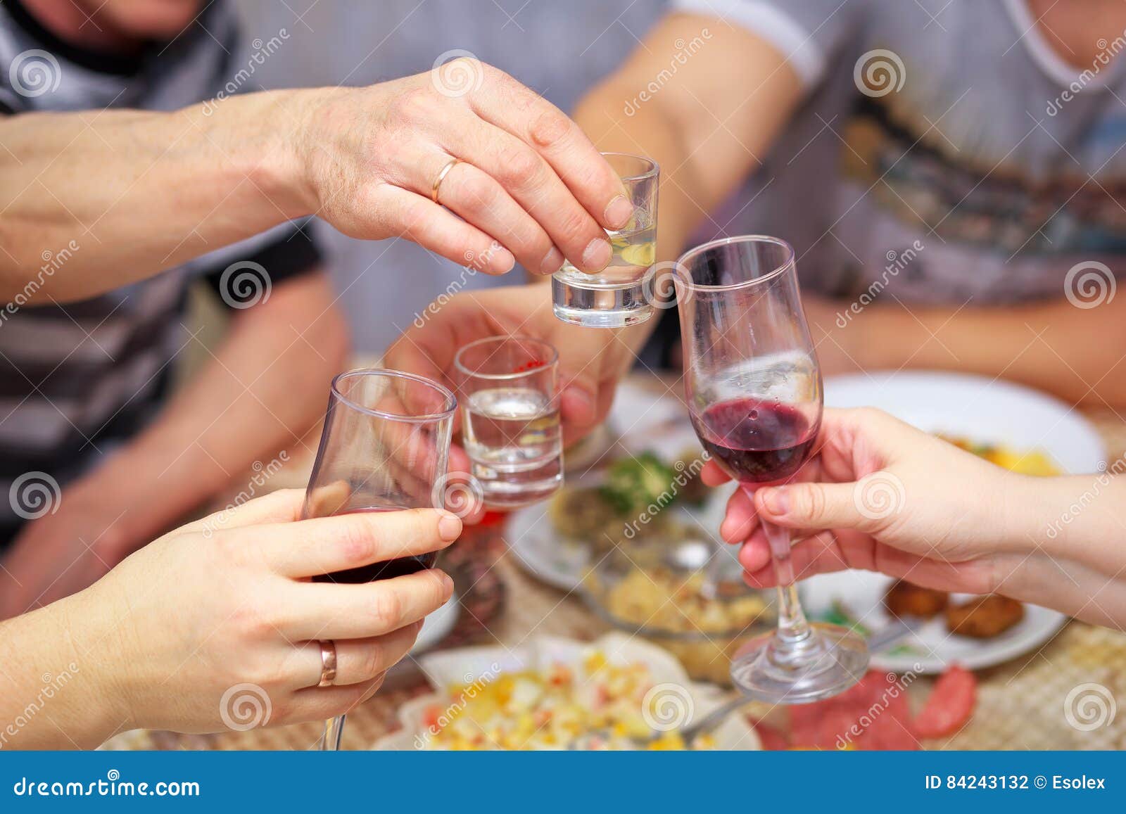 People Drink at the Table, Clink Glasses. Stock Photo Image of drunk