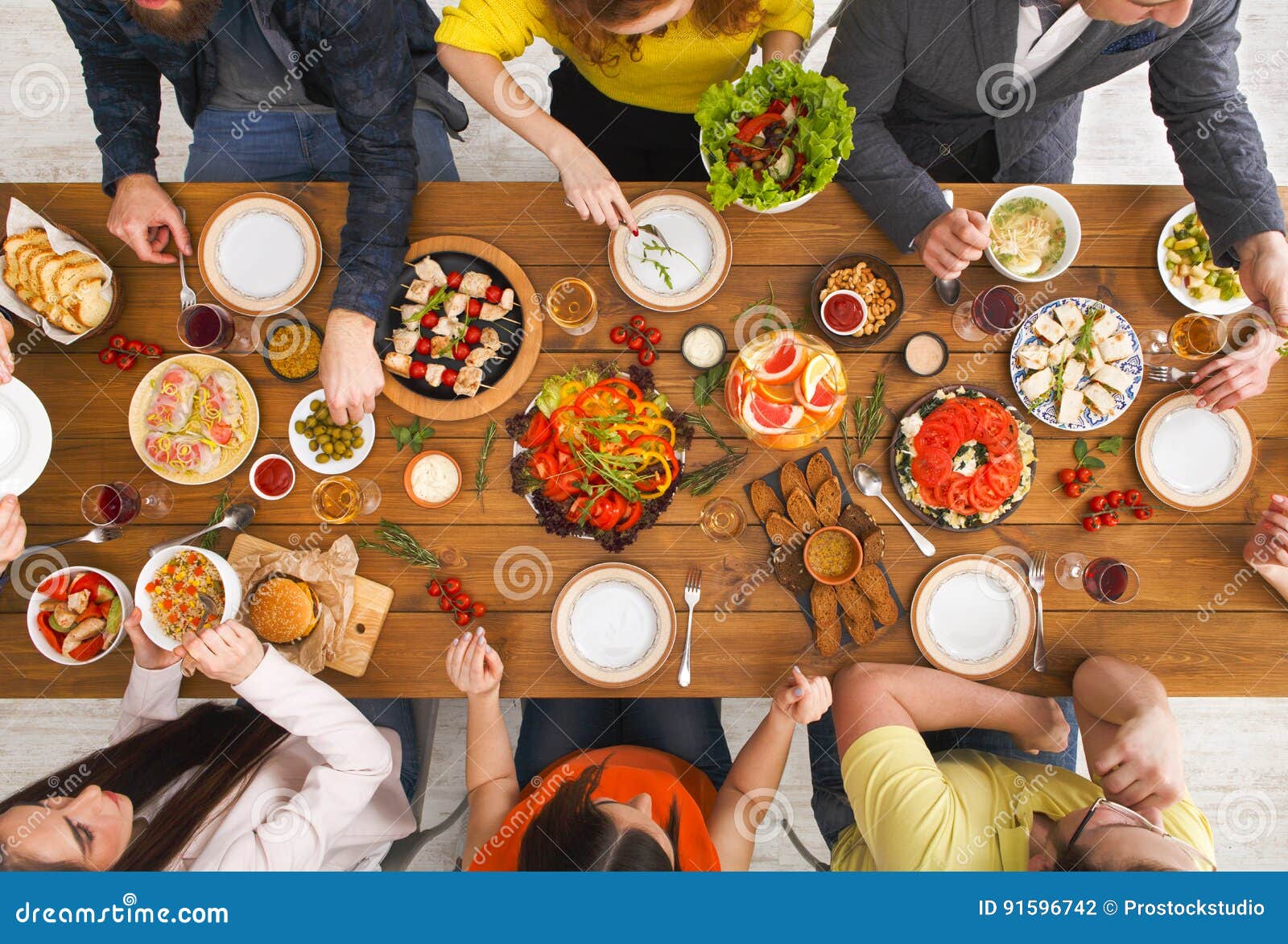 People Eat Healthy Meals at Served Table Dinner Party Stock Photo