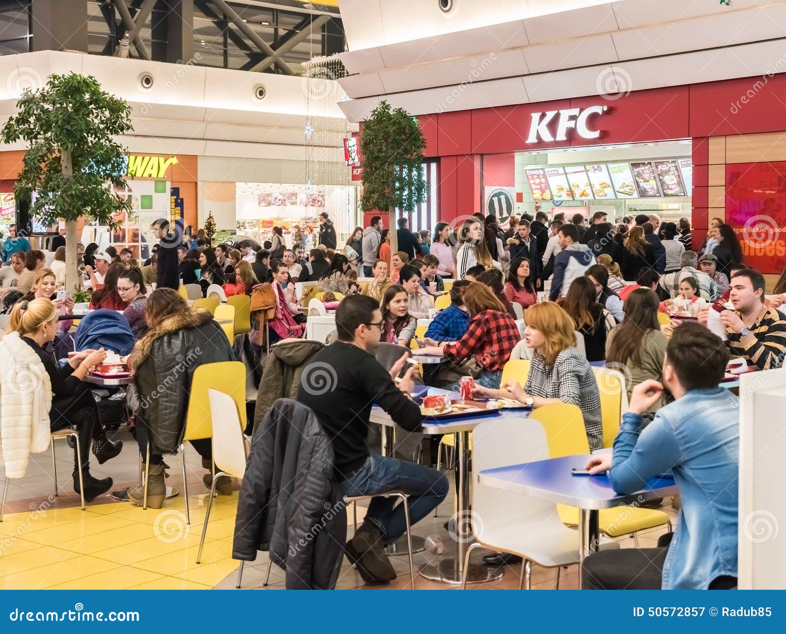  People  Eating Fast  Food  At Kentucky Fried Chicken 