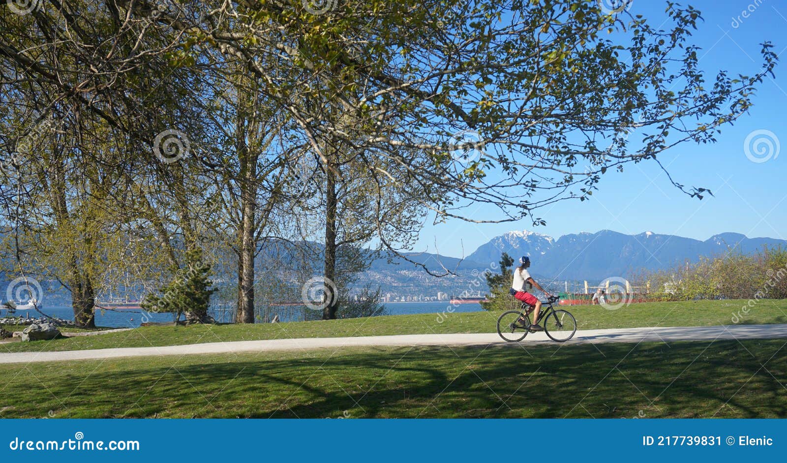 People Enjoy Bike Riding Along the Beach Path on Sunny Day. Beautiful ...