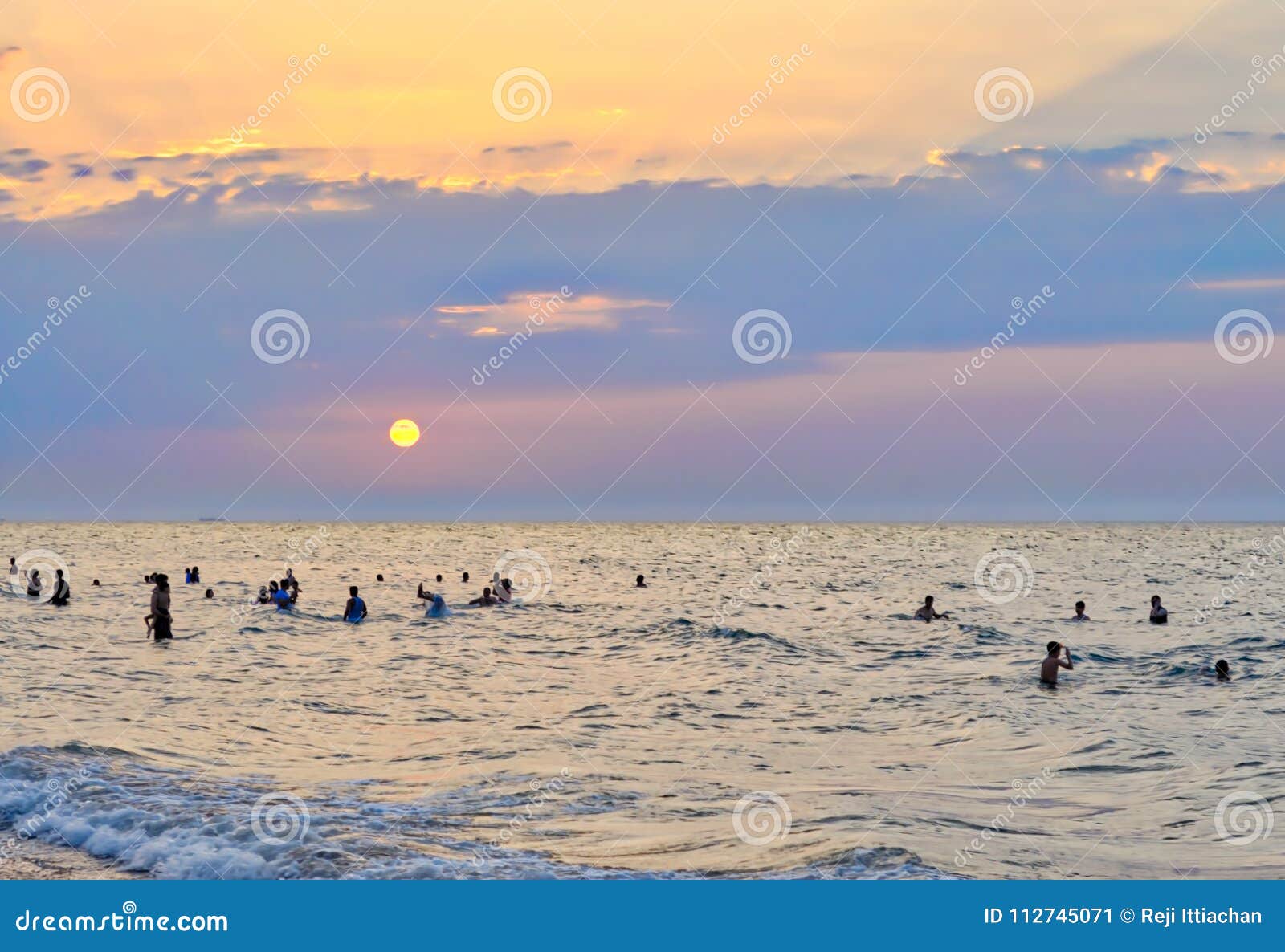 People Enjoying Sea and Sunset! Stock Image - Image of golden ...