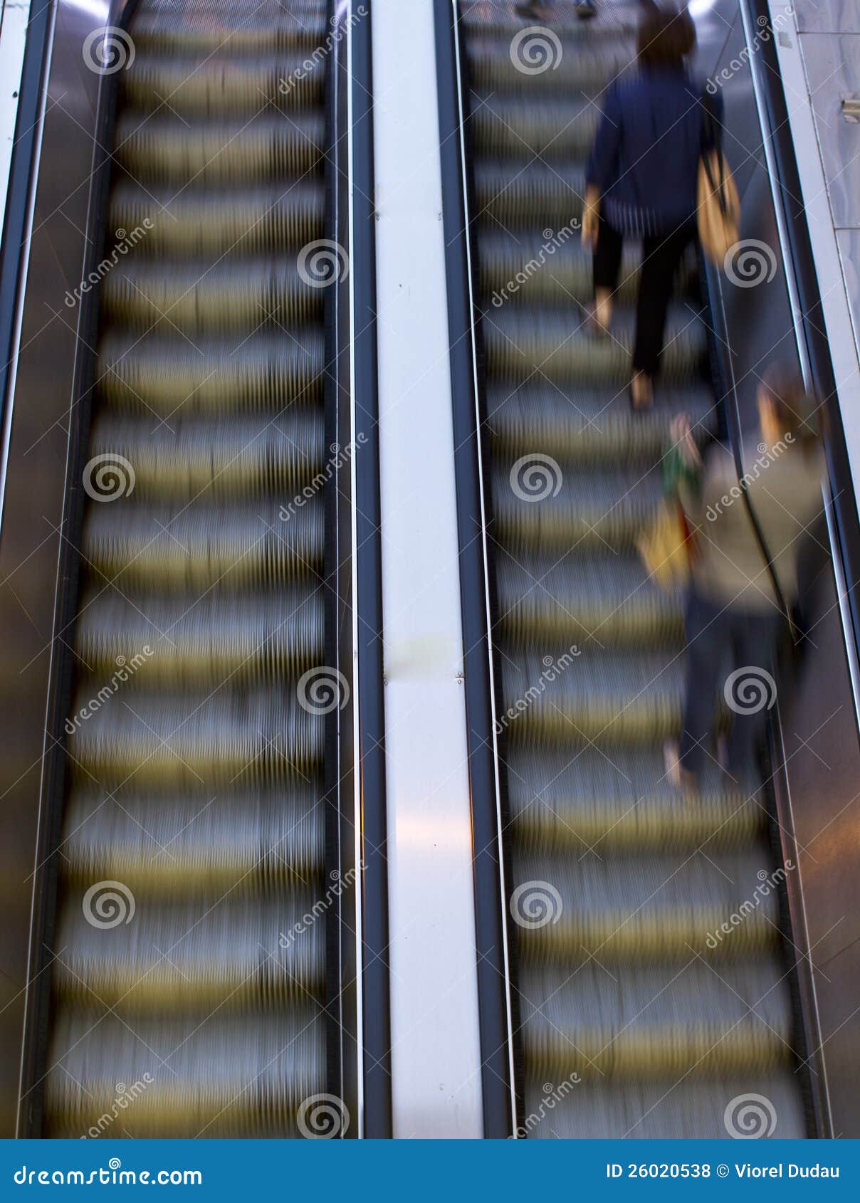 people on escalators