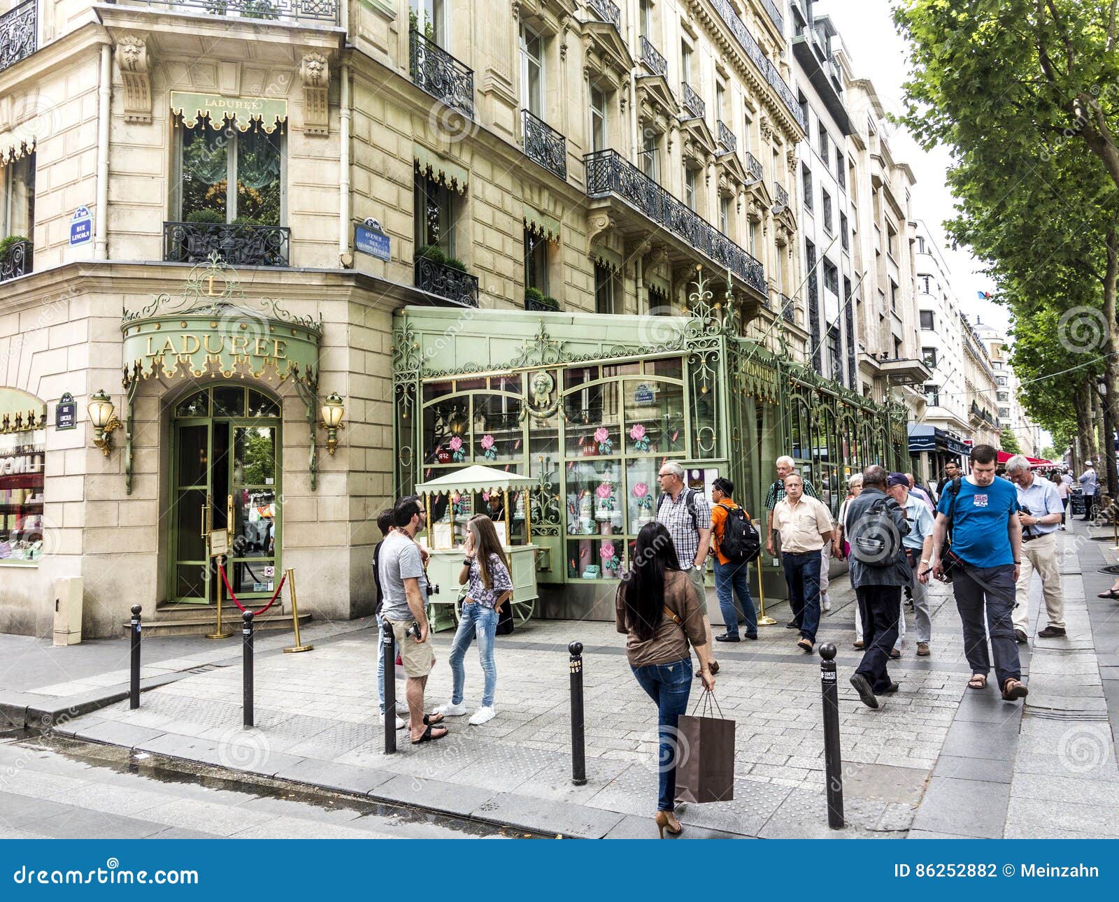 People in Front of LADUREE Shop at Champs Elysees Editorial