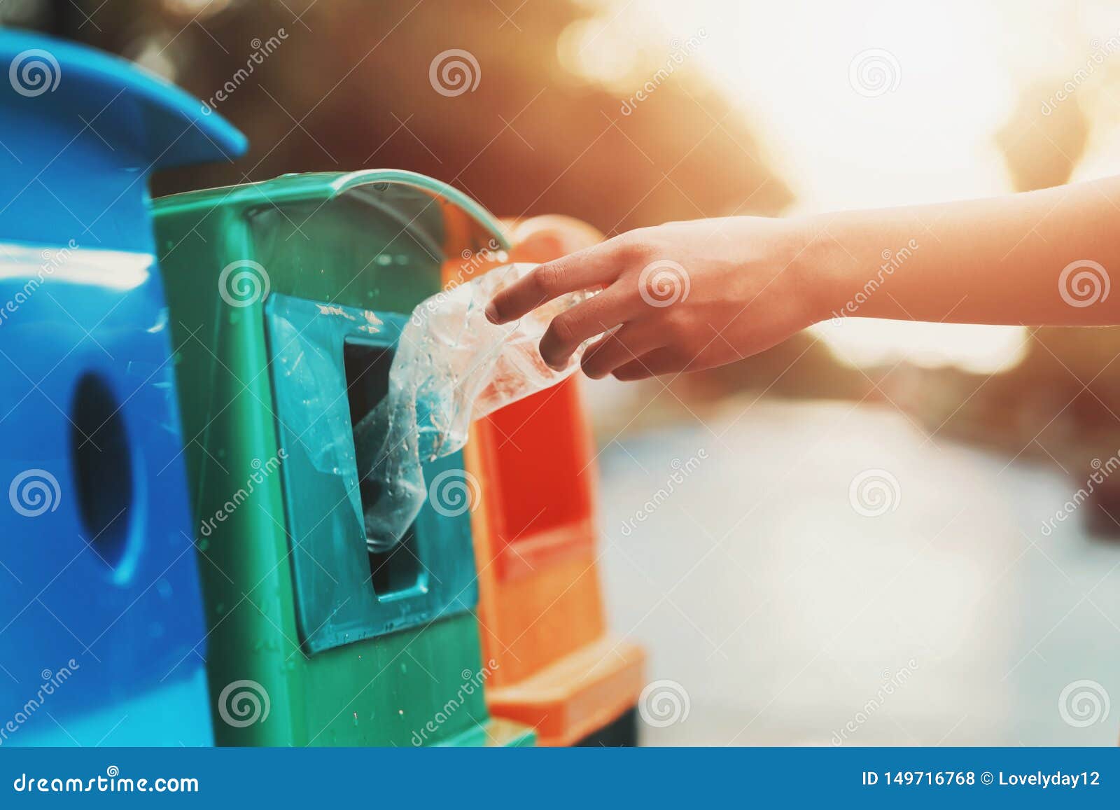 People Hand Holding Garbage Bottle Plastic Putting into Recycle Bin for