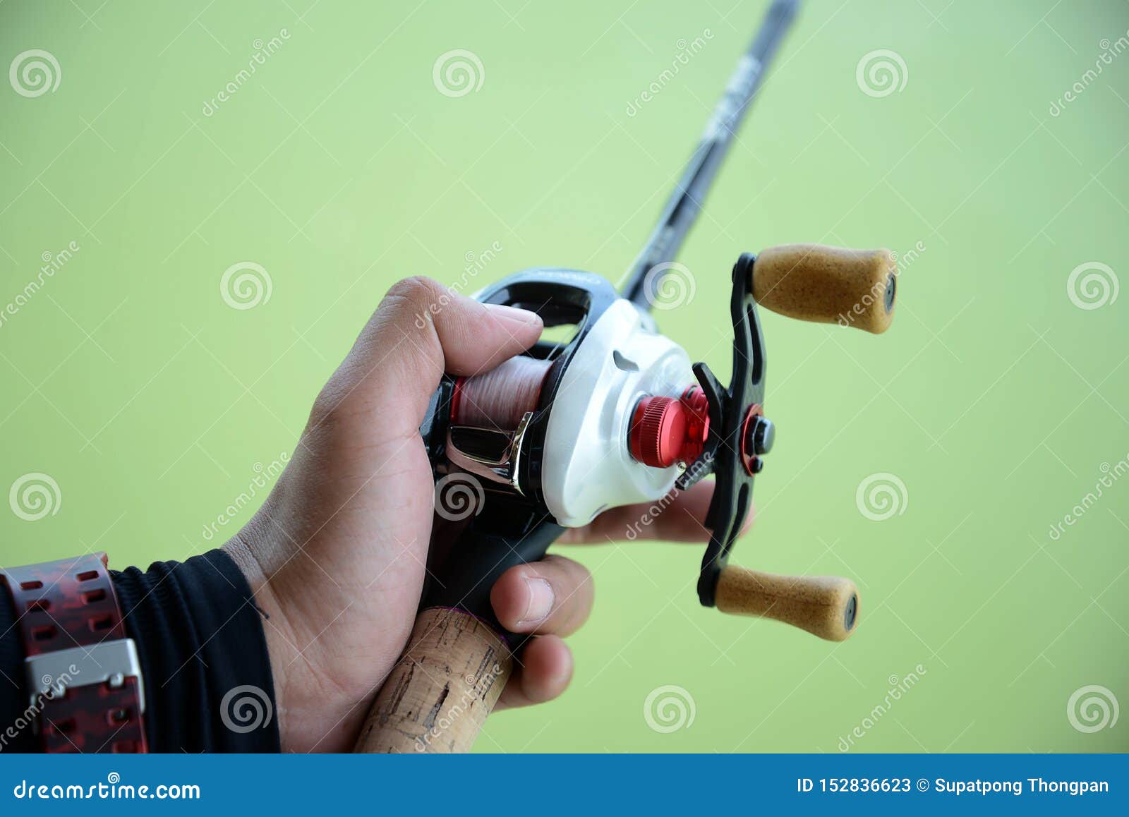 https://thumbs.dreamstime.com/z/people-holding-bait-casting-fishing-reel-people-holding-bait-casting-fishing-rod-reel-152836623.jpg