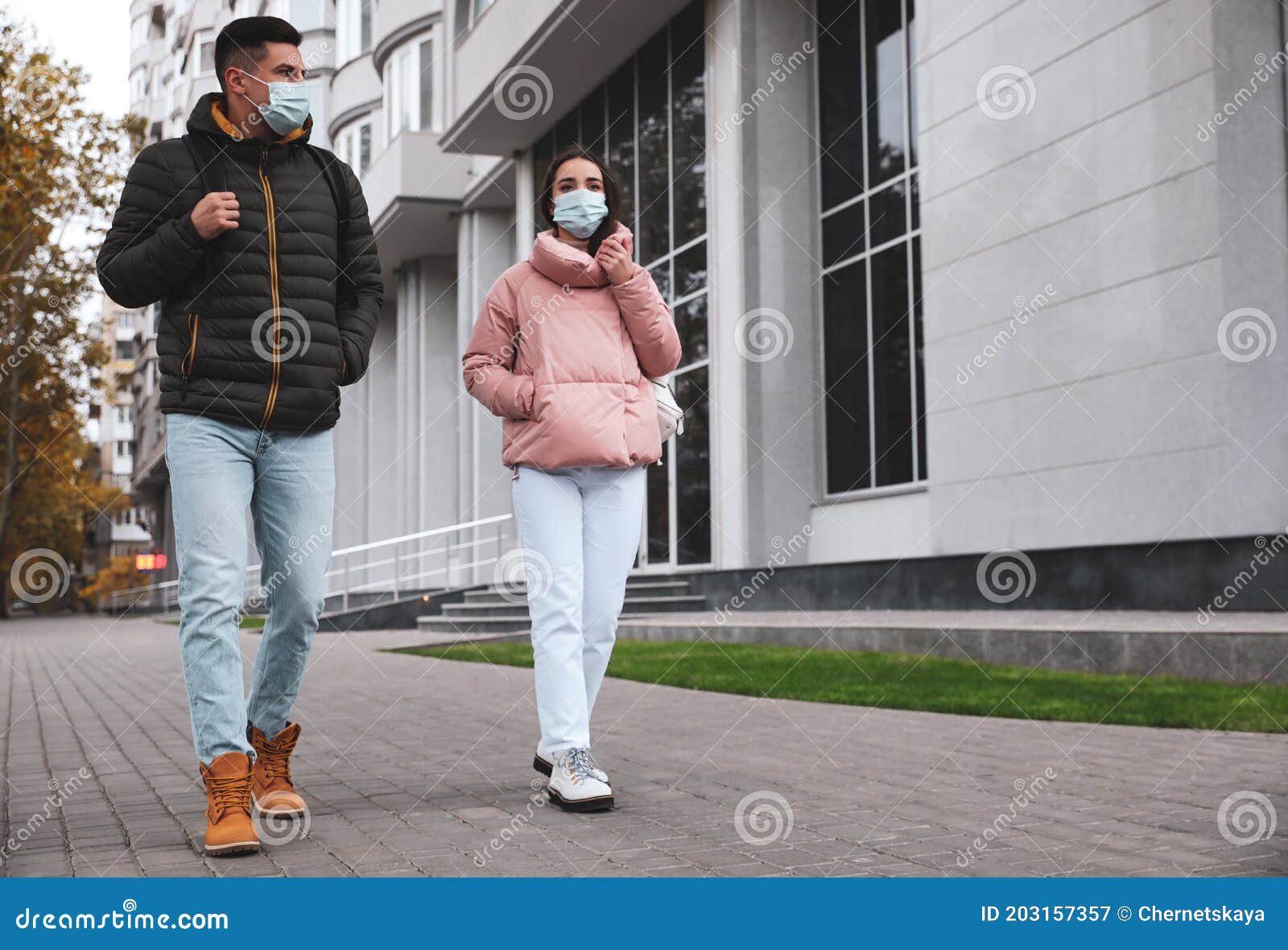 People in Medical Face Masks Walking Outdoors. Personal Protection ...