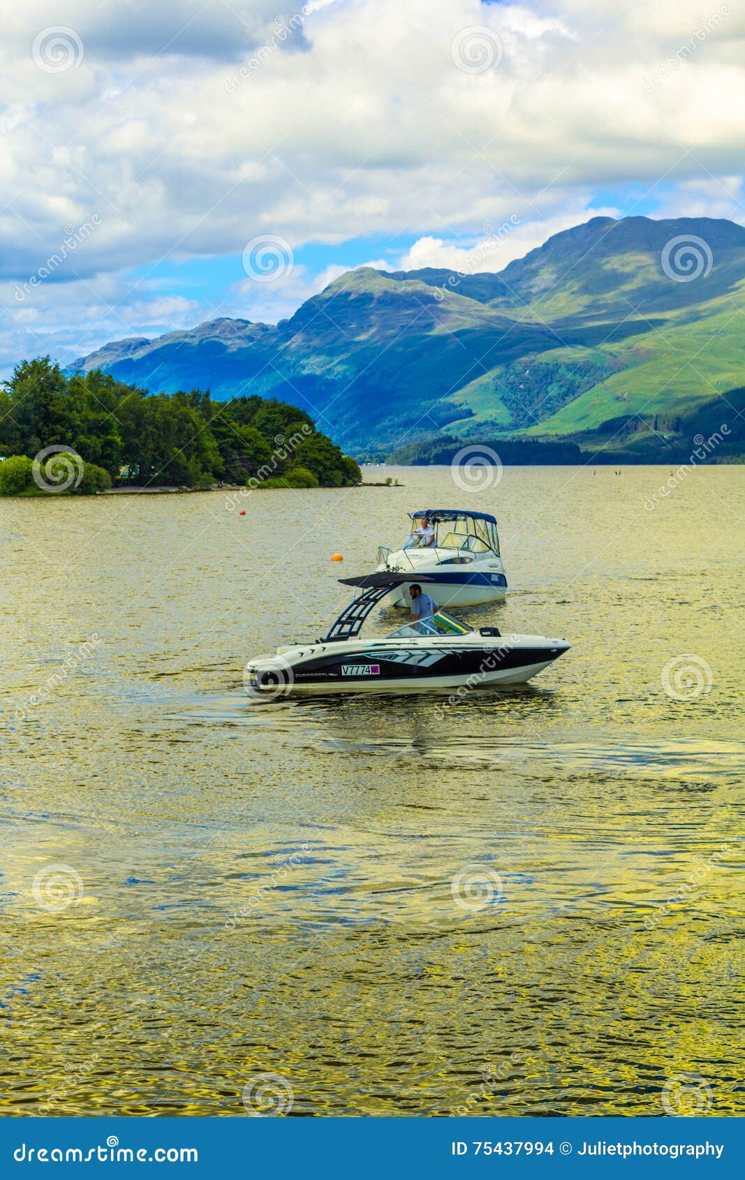 People on the Motor Boat at the Loch Lomond Lake in Scotland, 21 July