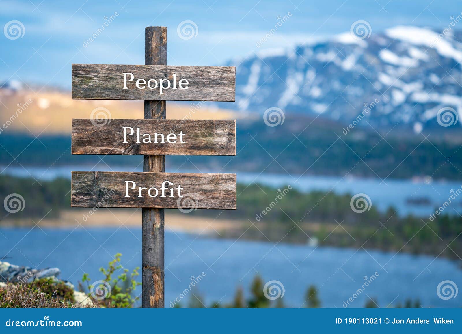 people planet profit text on wooden signpost outdoors