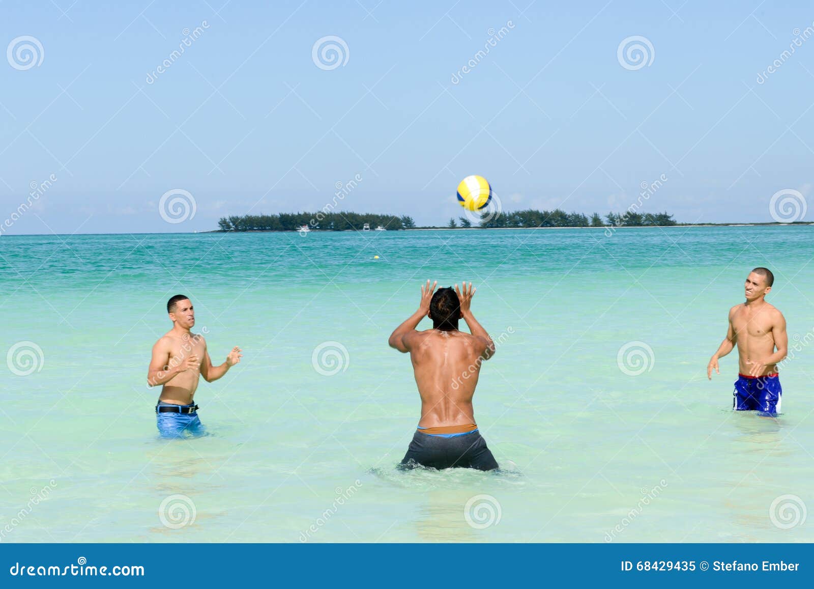 People Playing Volleyball In Clear Water Of Cayo Guillermo Beach