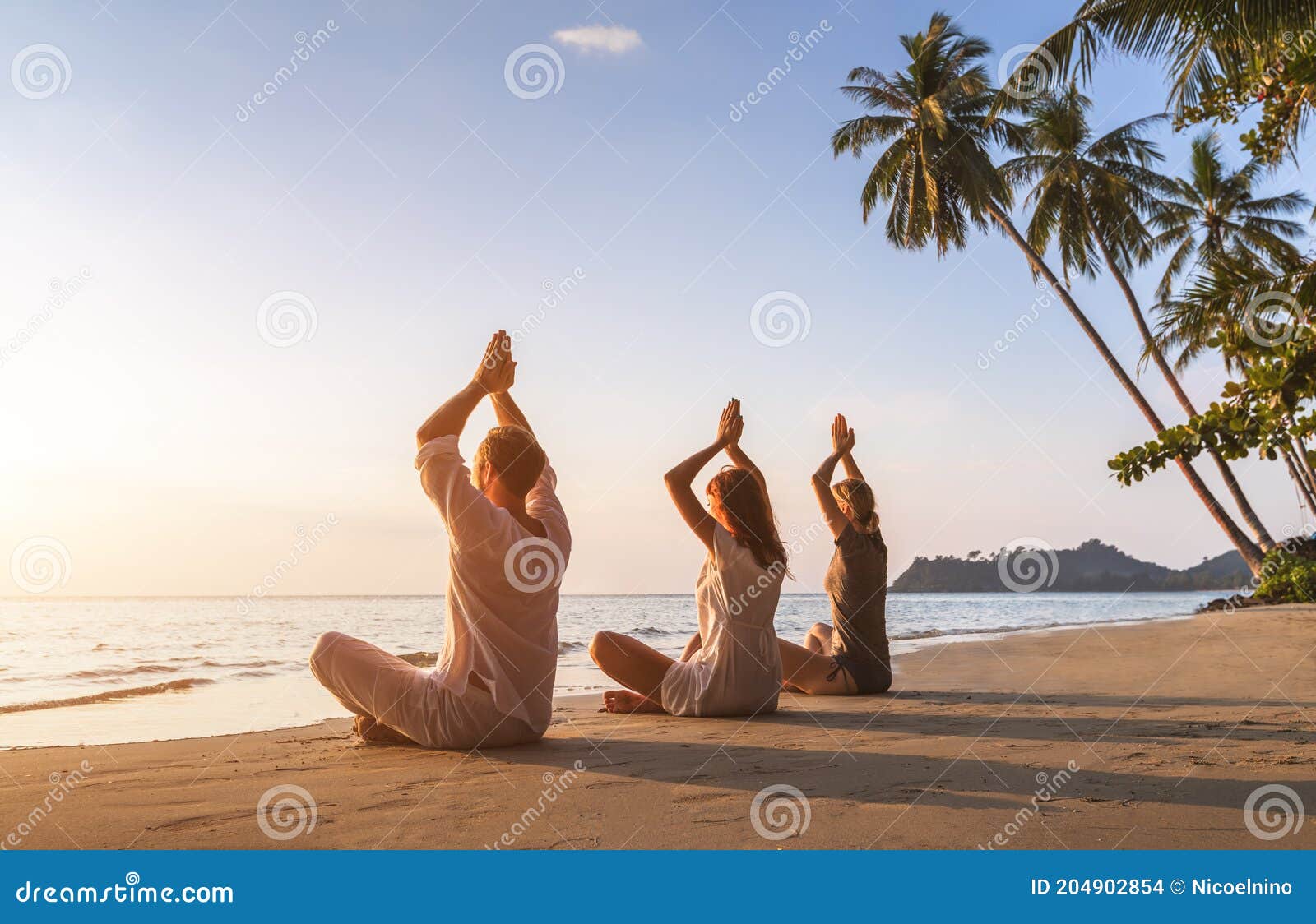 People Practicing Yoga on the Beach, Wellbeing, Warm Tropical Landscape