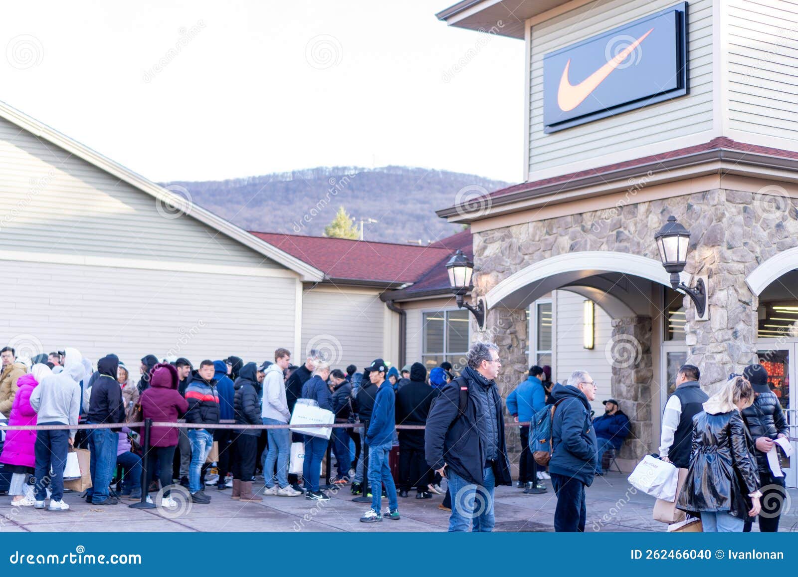 People Queuing in Line To Enter the Nike Store on Black Friday