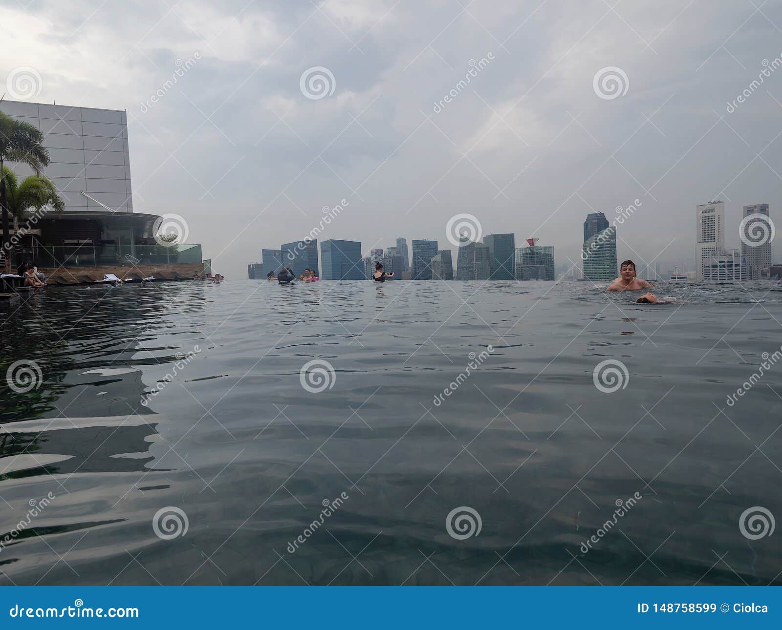 People Relaxing At The Marina Bay Sands Hotel Pool Singapore