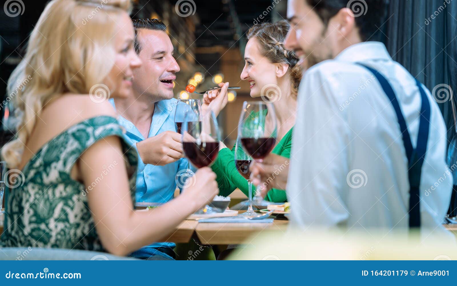 People in a Restaurant Eating and Drinking Red Wine Stock Image Image