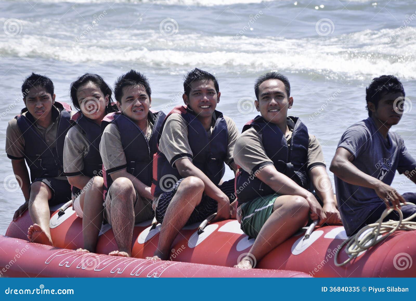 People Riding On A Banana Boat In Bali Beach Editorial