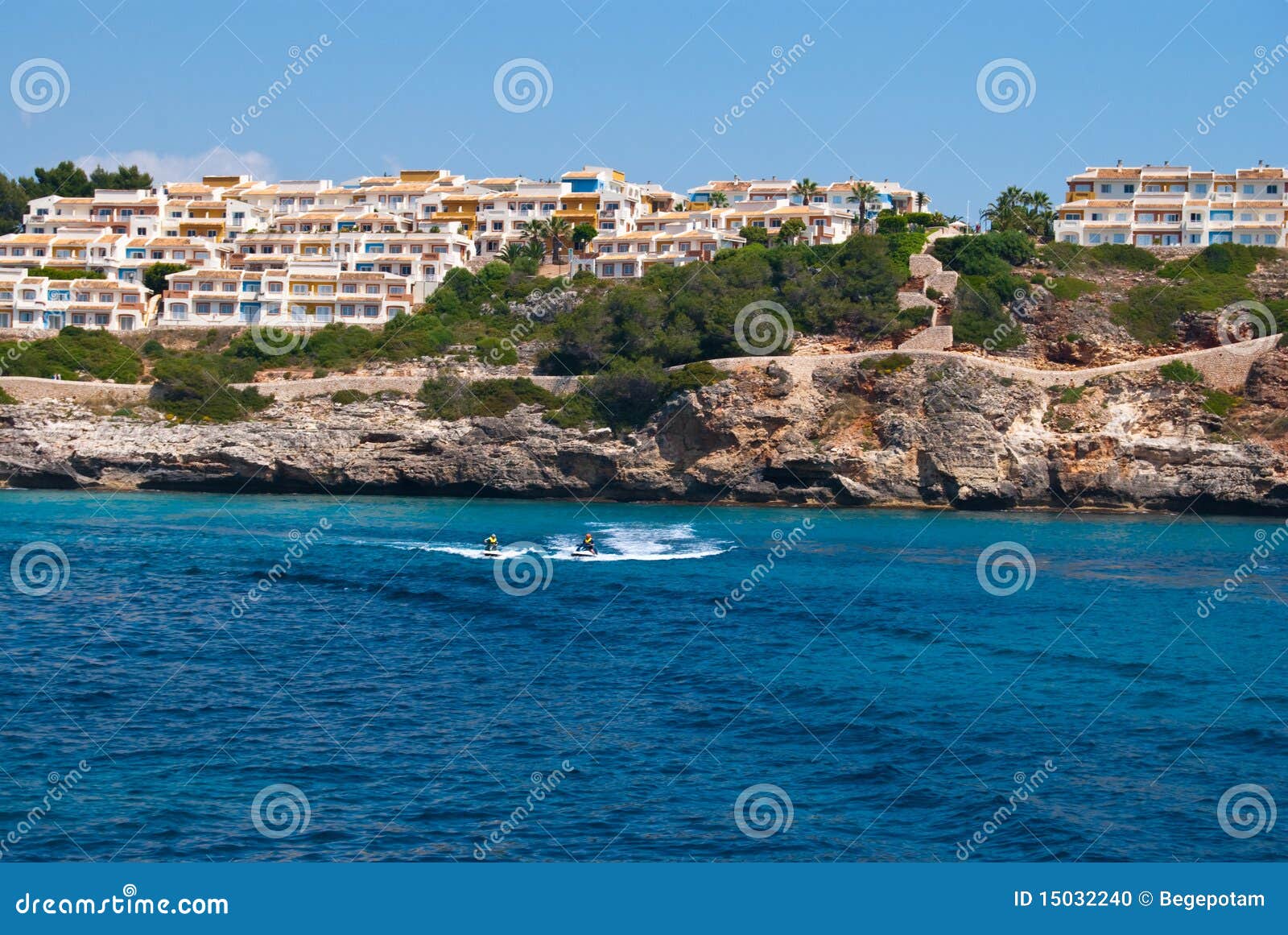 people riding water scooters at cala romantica