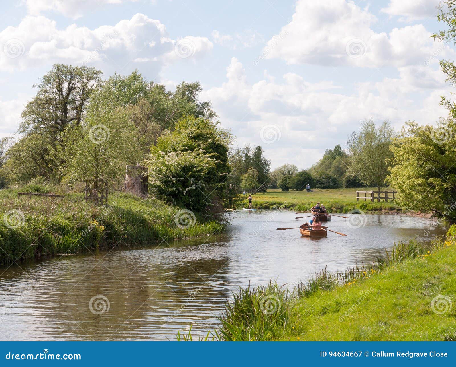 people rowing boats on the river stour editorial photo