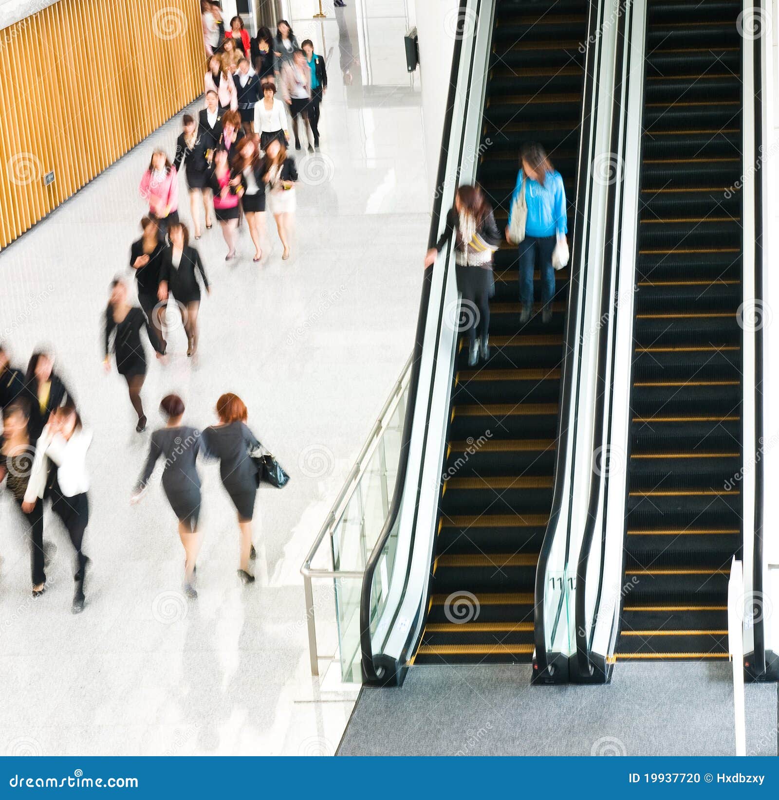 people rushing on escalator