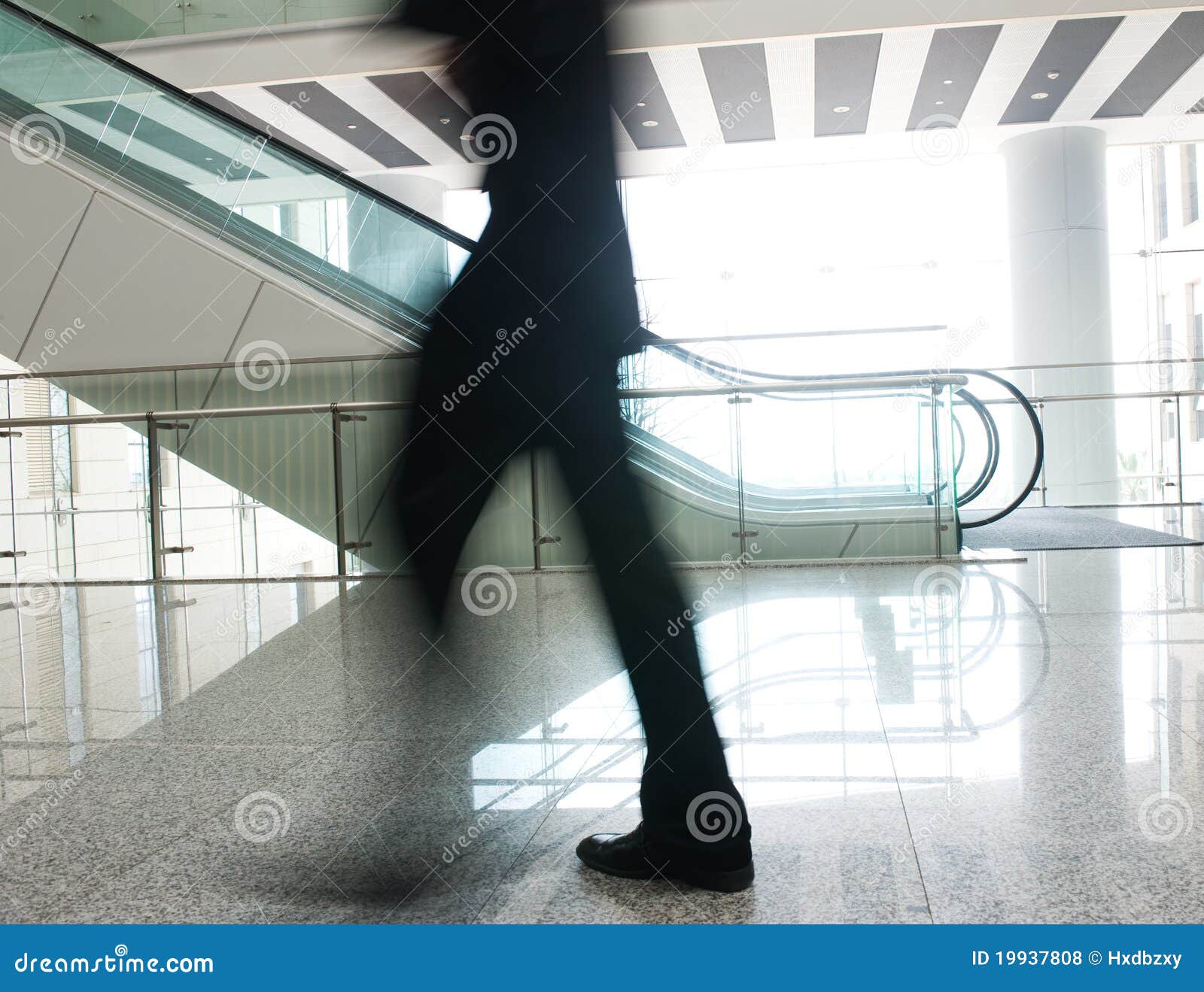 people rushing on escalator