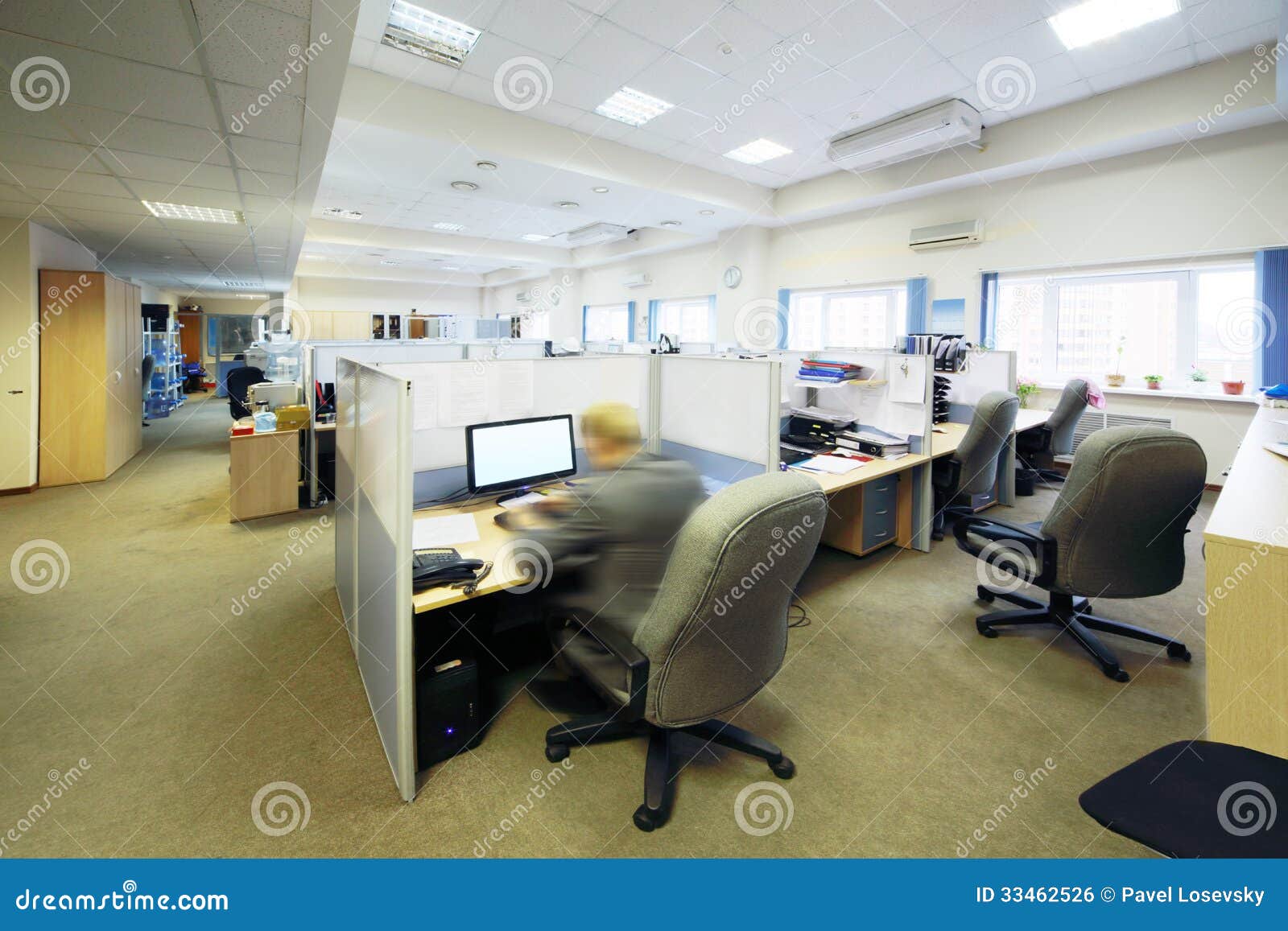 People Sit in Office with Separated by Partition Places Stock Photo