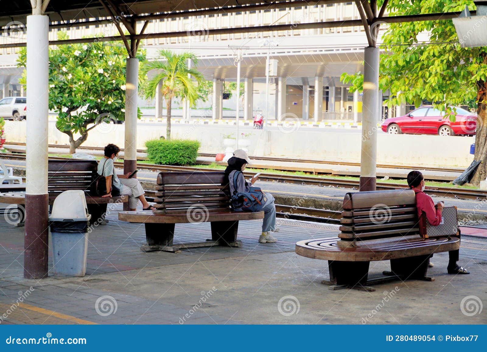 People Sit at Seat for Waiting Train Editorial Stock Image - Image of