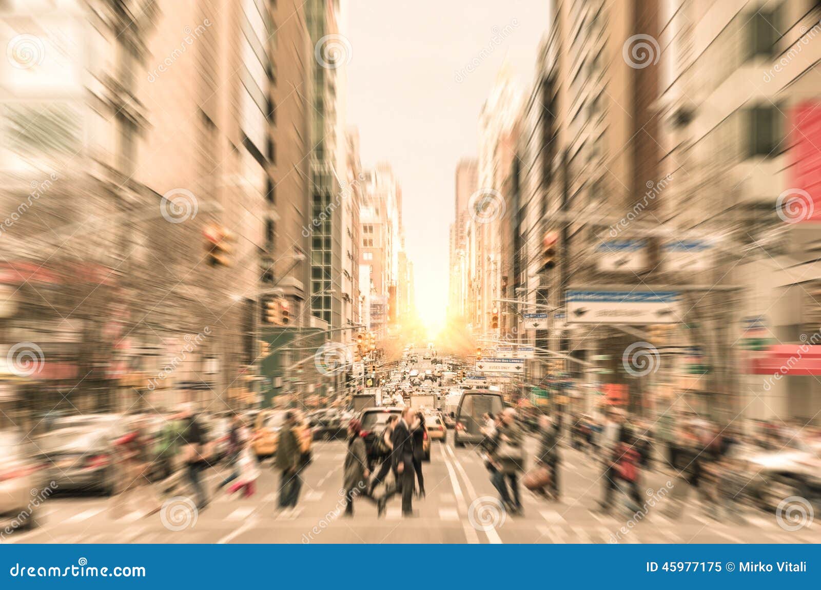 people on the street on madison avenue in manhattan downtown before sunset in new york city - commuters walking on zebra crossing