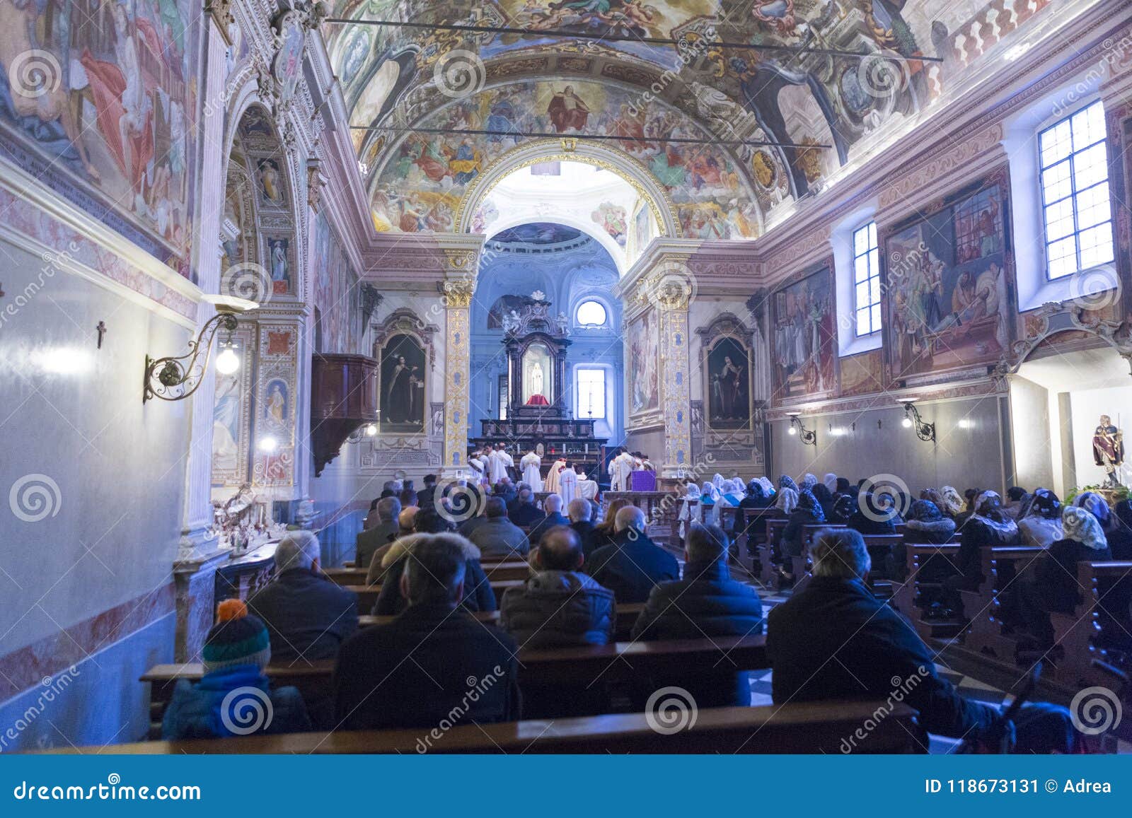 people taking part at the sunday mass in chiesa di san rocco