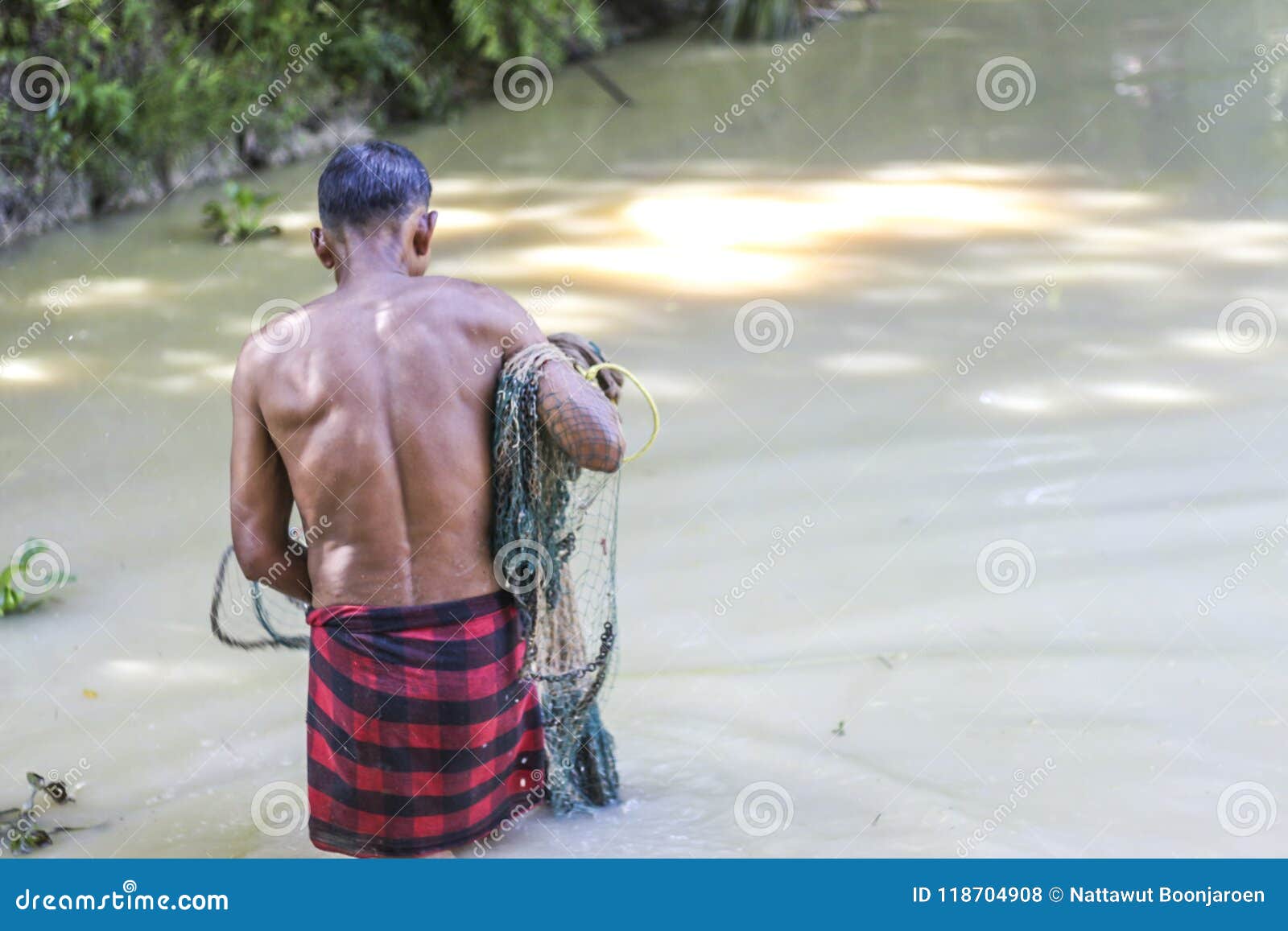 Throw the Net into the Water To Catch the Fish. Editorial Stock Photo