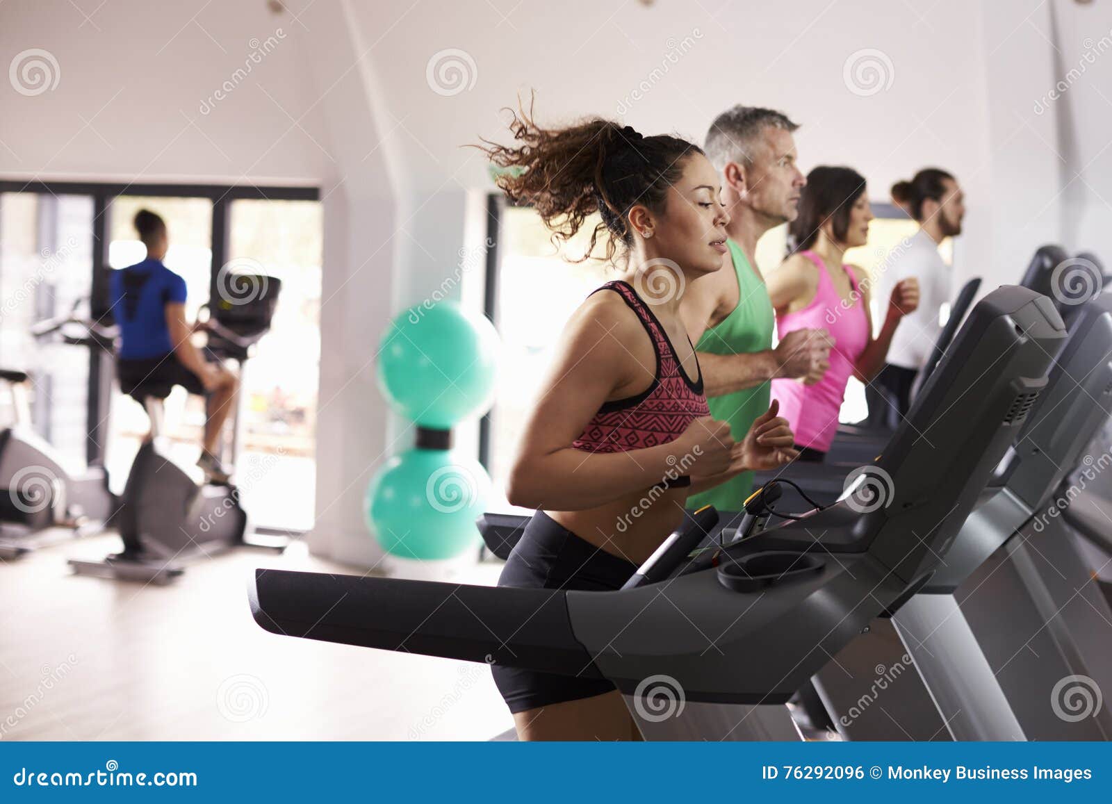 People Using Equipment in Busy Gym Stock Photo Image of hispanic