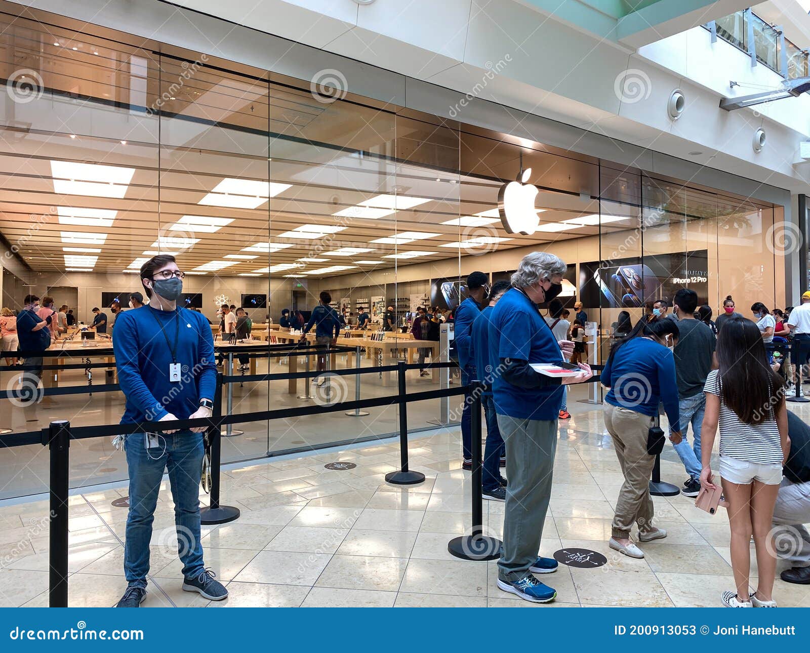 people walking past the apple store at The Florida Mall enclosed shopping  mall orlando Florida USA United States of America Stock Photo - Alamy