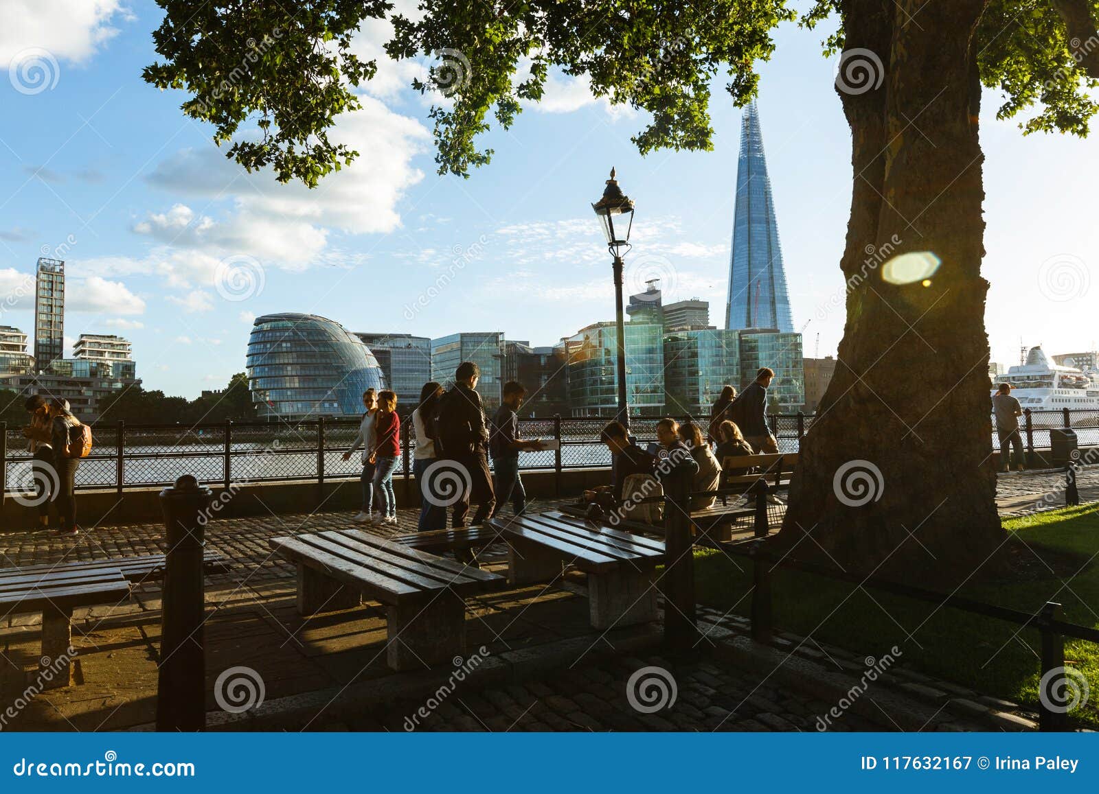 People Walk on the Embankment Near Tower Millennium Pier. Shard and ...