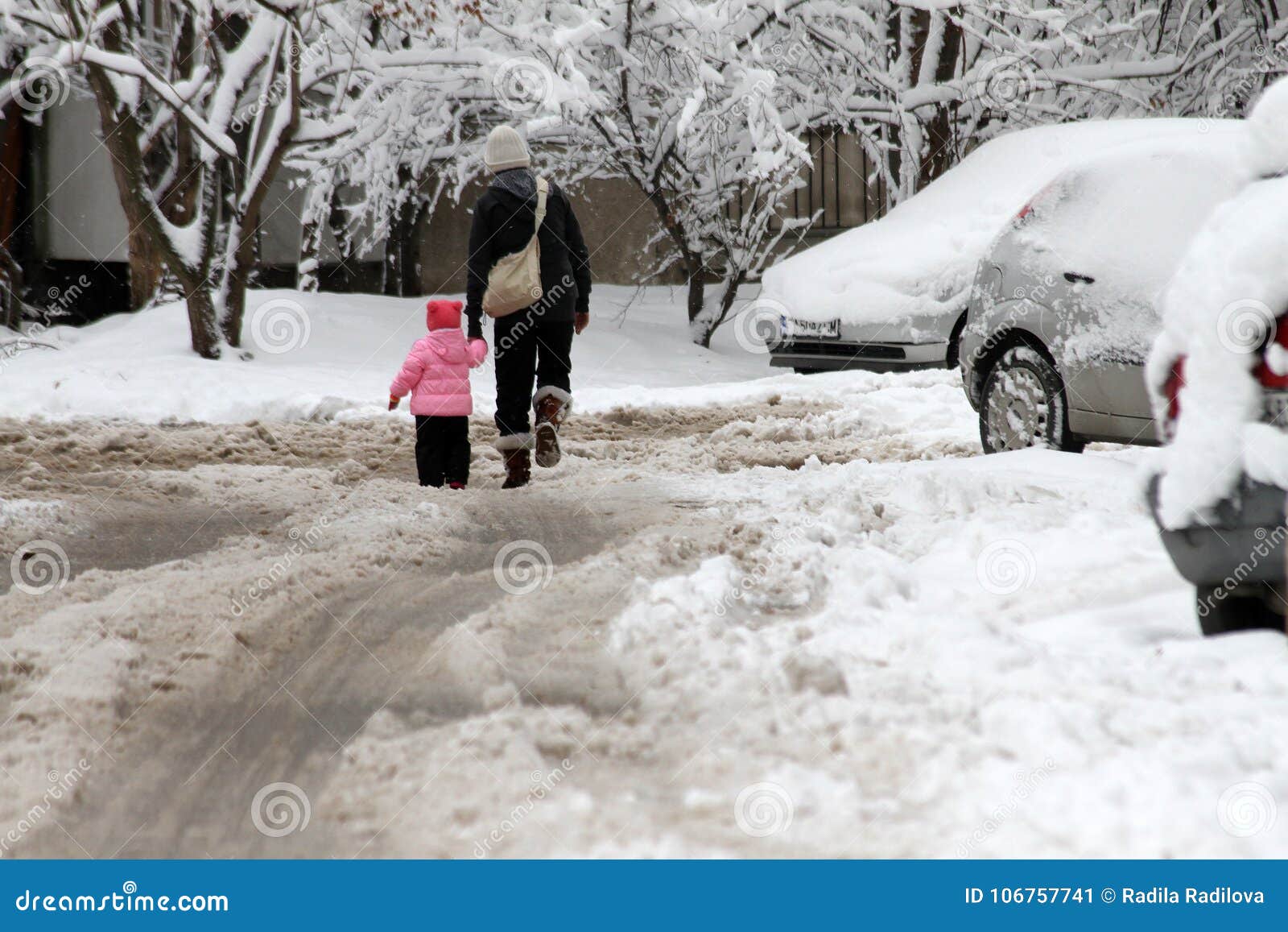 People Walk On A Very Snowy Sidewalk People Step On An Snow Stray Pathway Icy Sidewalk