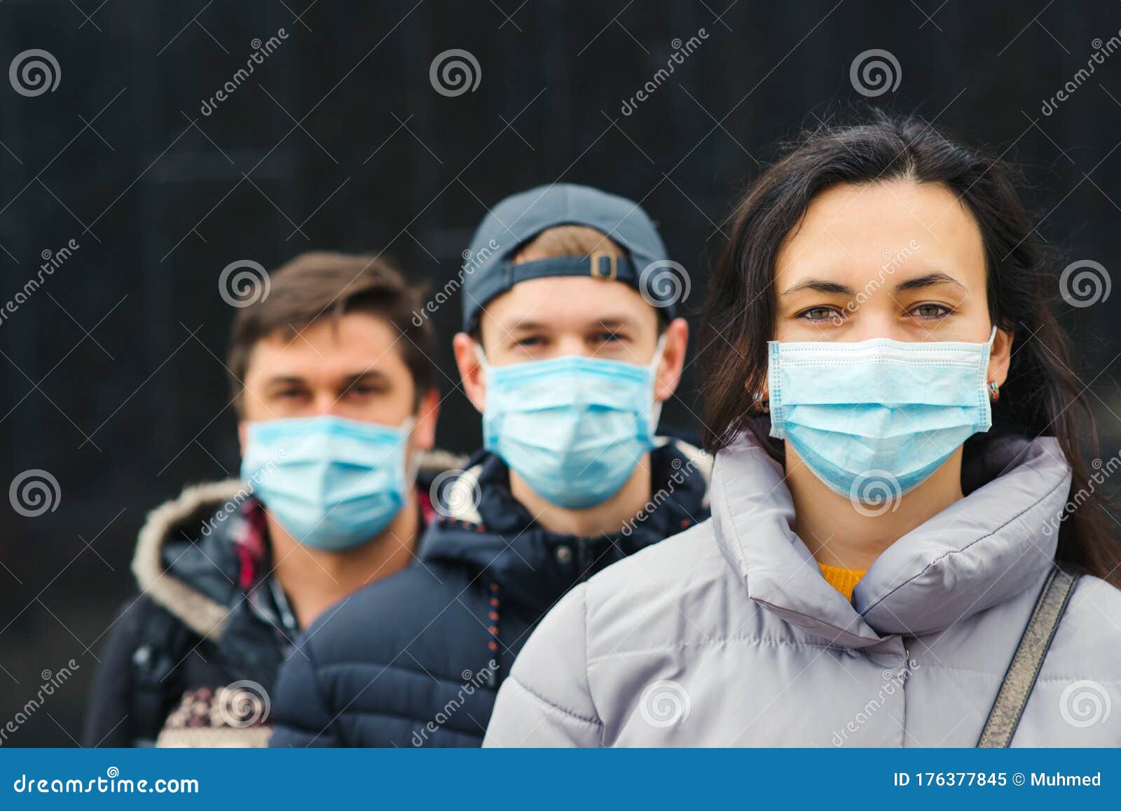 people wearing face masks outdoors. coronavirus quarantine