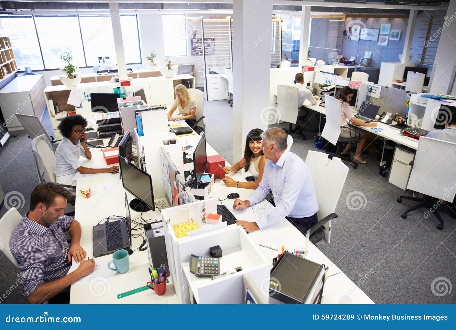 people working in a busy office