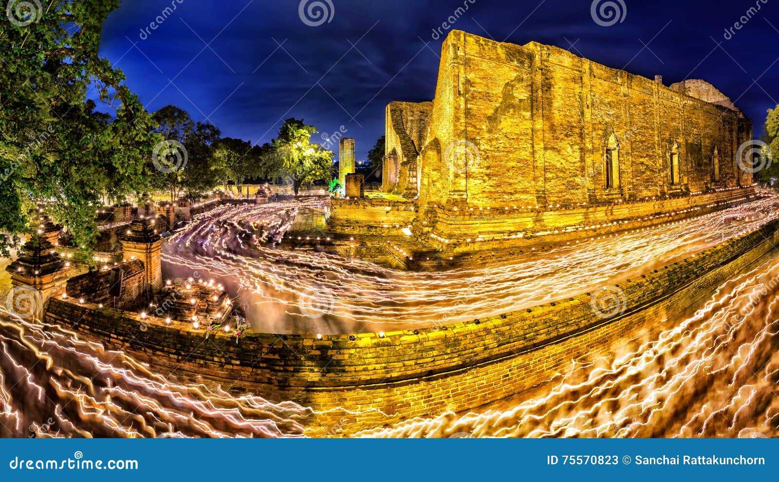 peoples walking with lighted candles around ancient temple, candles light procession around the uposatha, which we can call