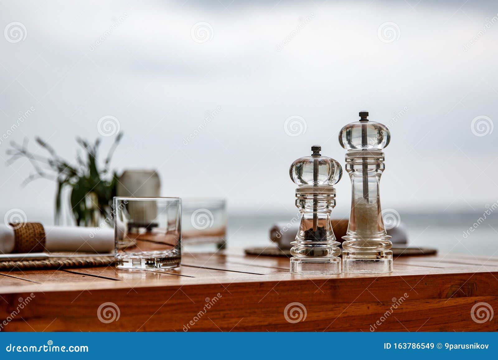 Pepper and Salt Shaker on the Table of a Coastal Cafe Stock Image