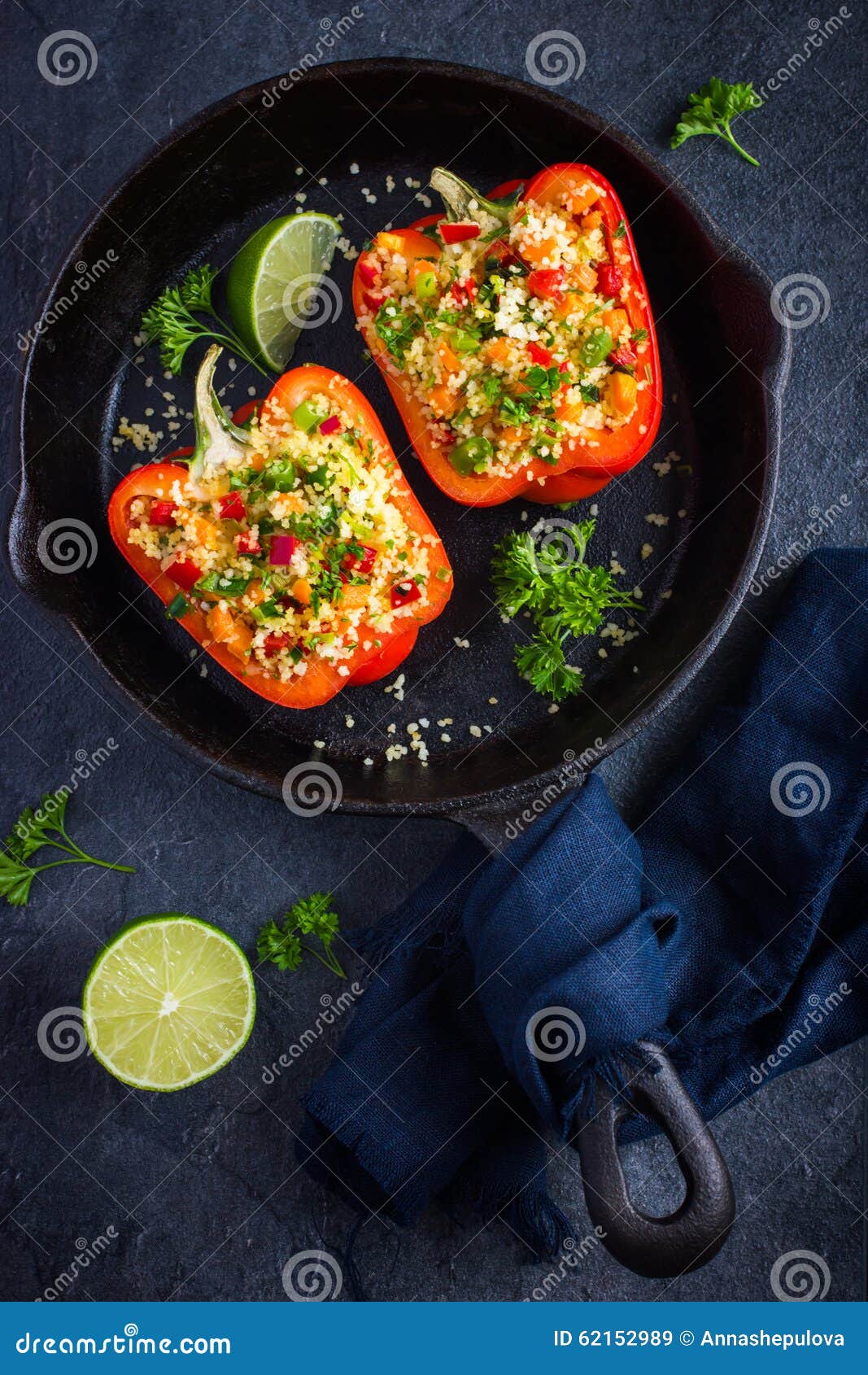 peppers staffed with coucous and vegetables on cast iron pan