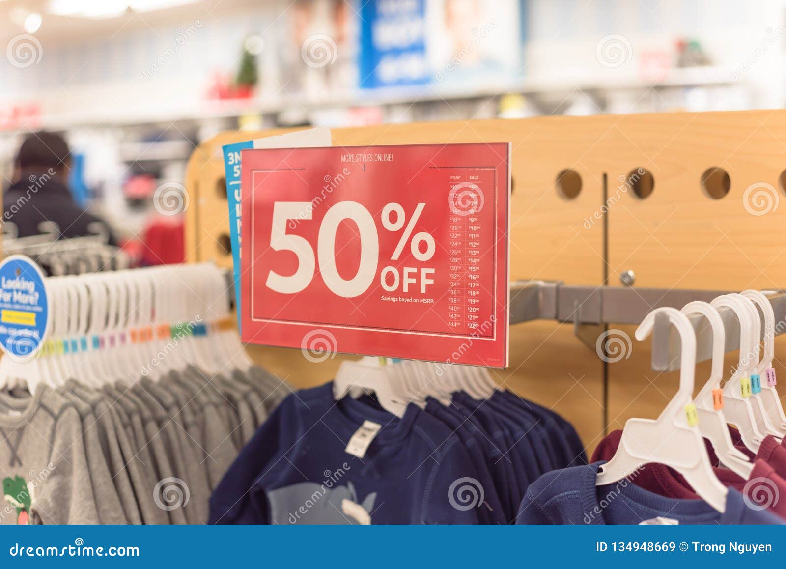 50 Percent Off Sale Sign Over Clothes At Baby Clothing ...