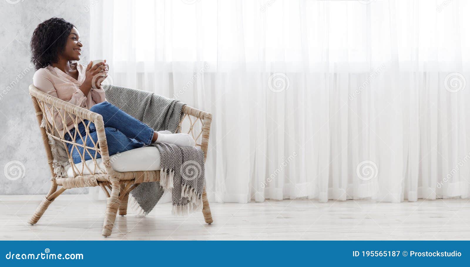 Perfect Day Off Cheerful Black Woman Relaxing In Wicker Chair With