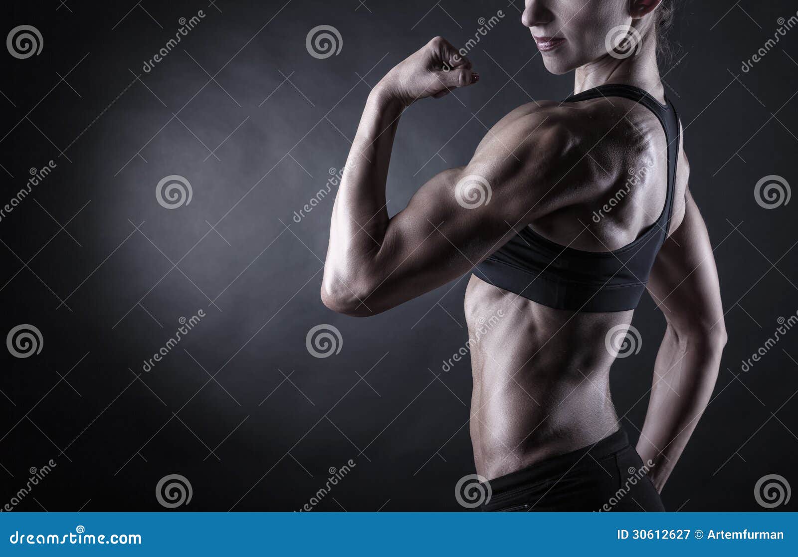 Young Woman Posing And Showing Biceps Stock Photo, Picture and Royalty Free  Image. Image 95690136.