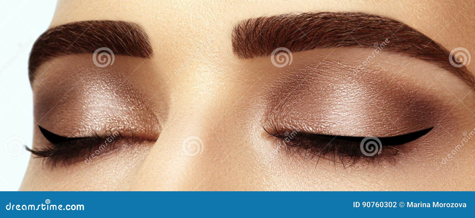 perfect  of eyebrows, brown eyeshadows and long eyelashes. closeup macro shot of fashion smoky eyes visage