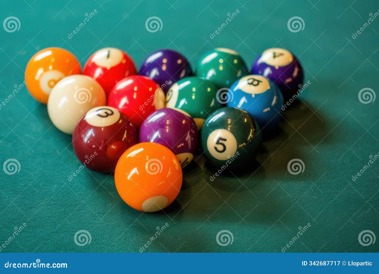 a perfectly arranged set of colorful billiard balls on a green table, ready for the break shot