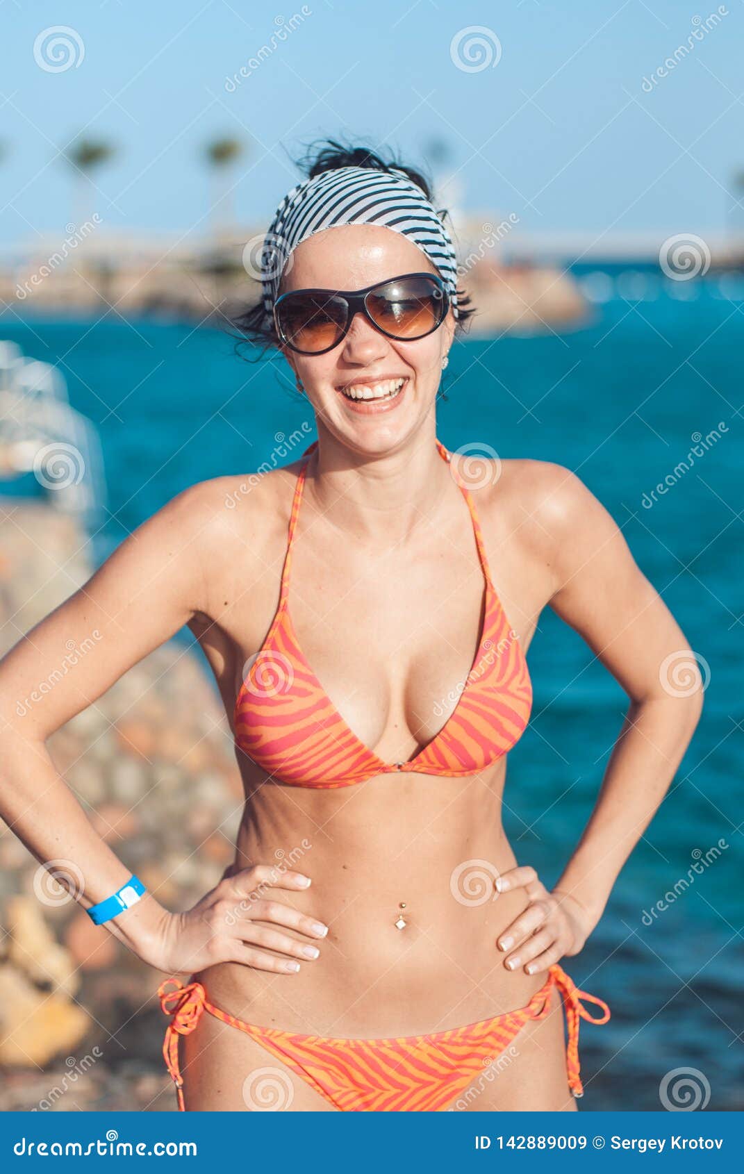 Perfectly Built Beautiful and Young Girl with Wide Hips in a Striped