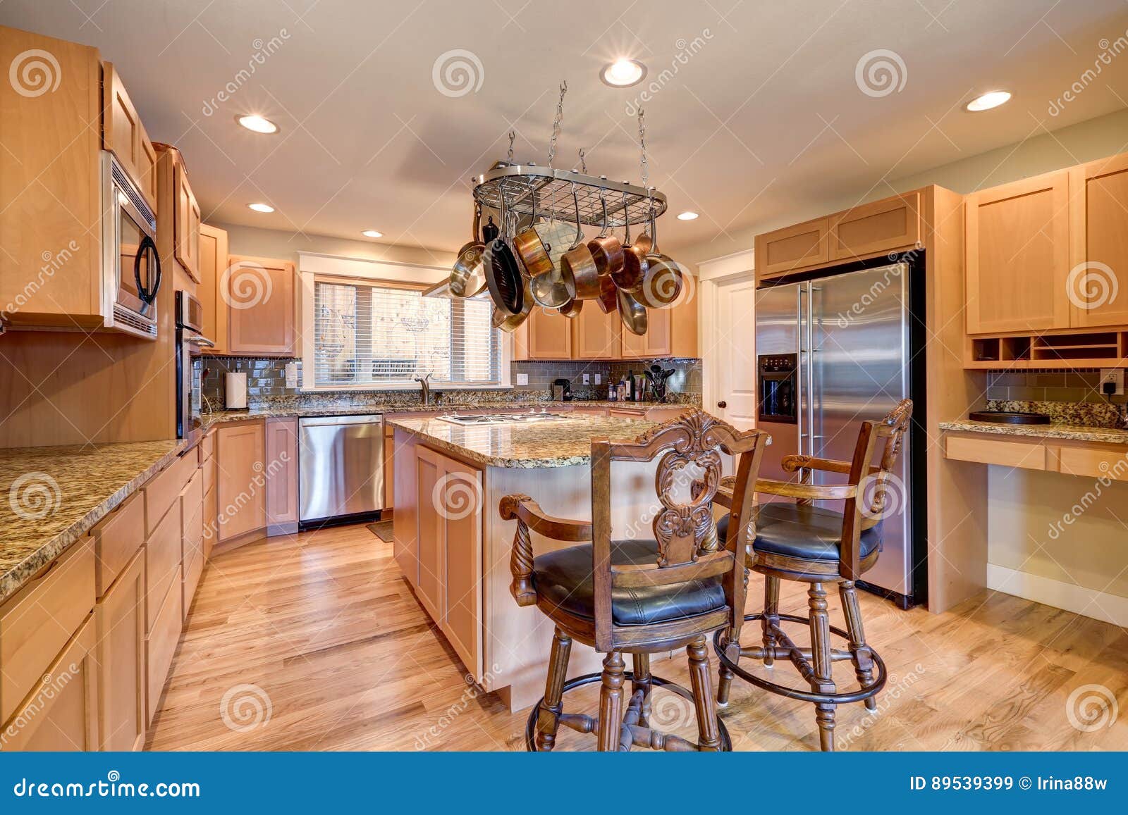 Perfectly Designed Light Kitchen With Granite Counters Stock Image