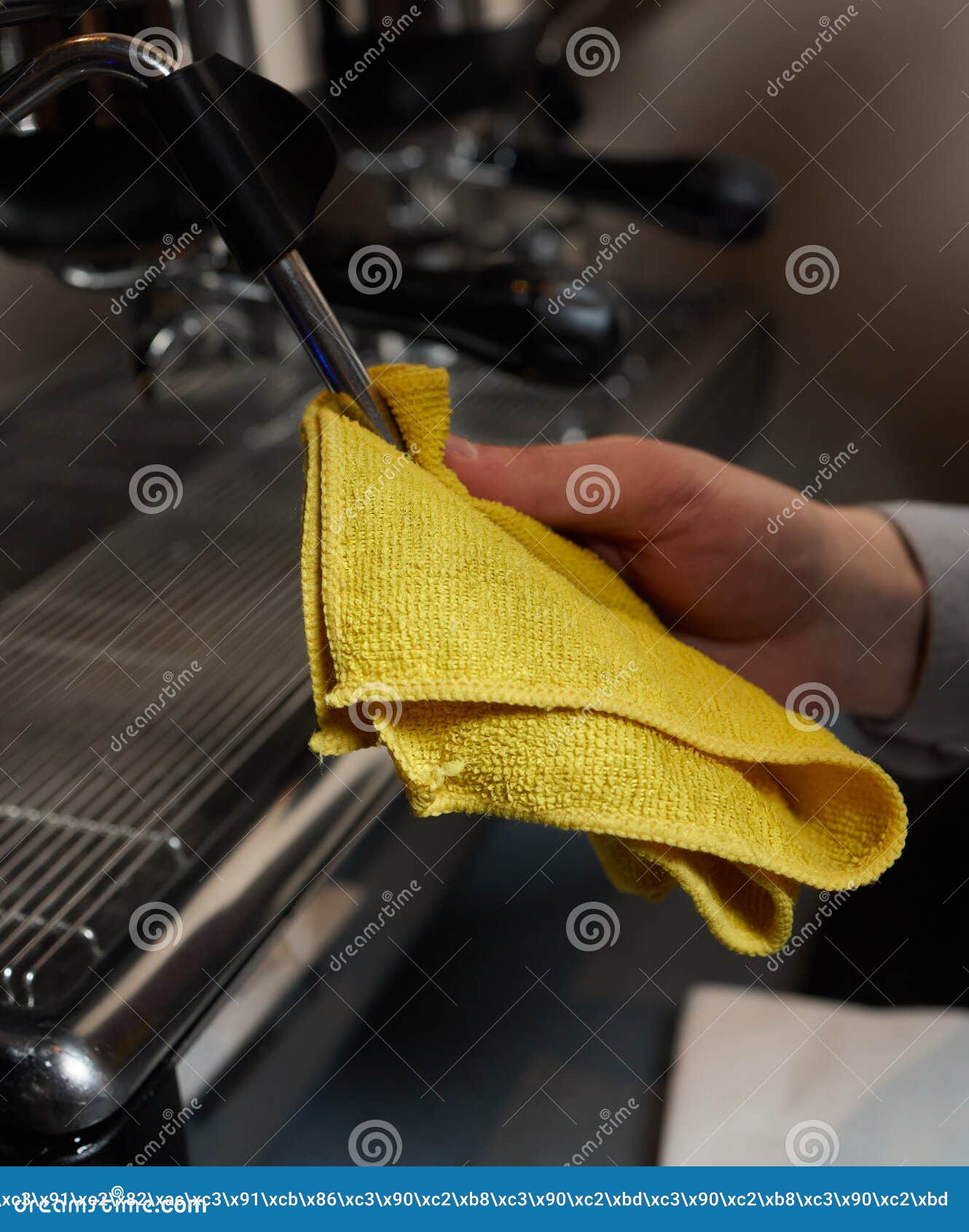 A Perfectly Lit Cleaning Cloth Sat upon an Espresso Machine. Stock