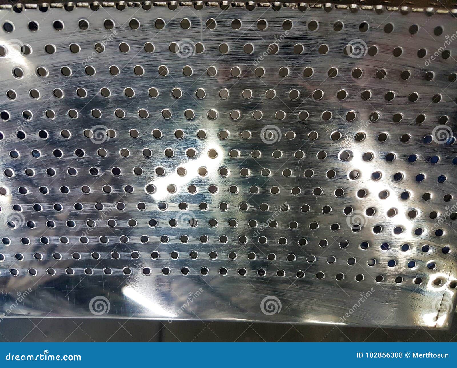 Perforated Metal Texture Close Up Chrome Surface Stock Photo