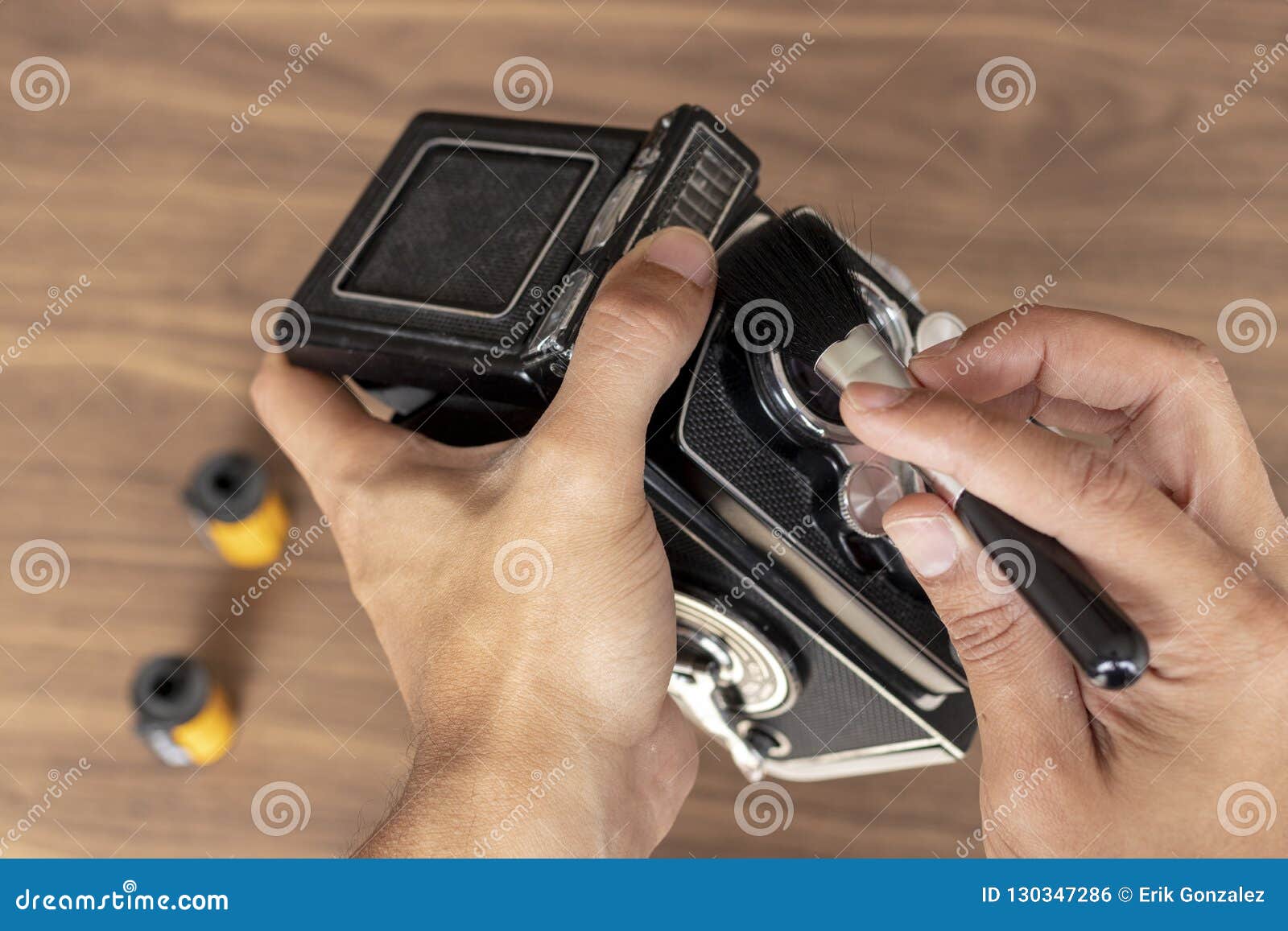 Performing Cleaning of Vintage Photo Camera Stock Photo Image of
