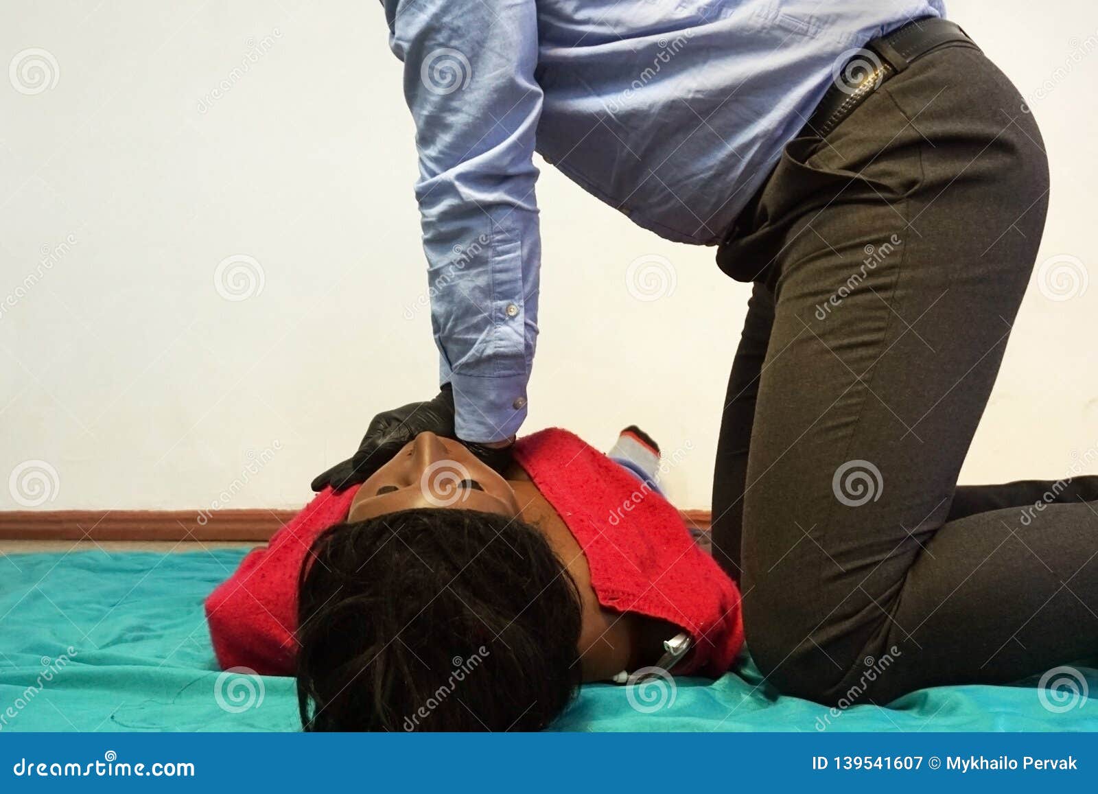 Performing Cpr On A Simulation Mannequin Dummy During Medical Training
