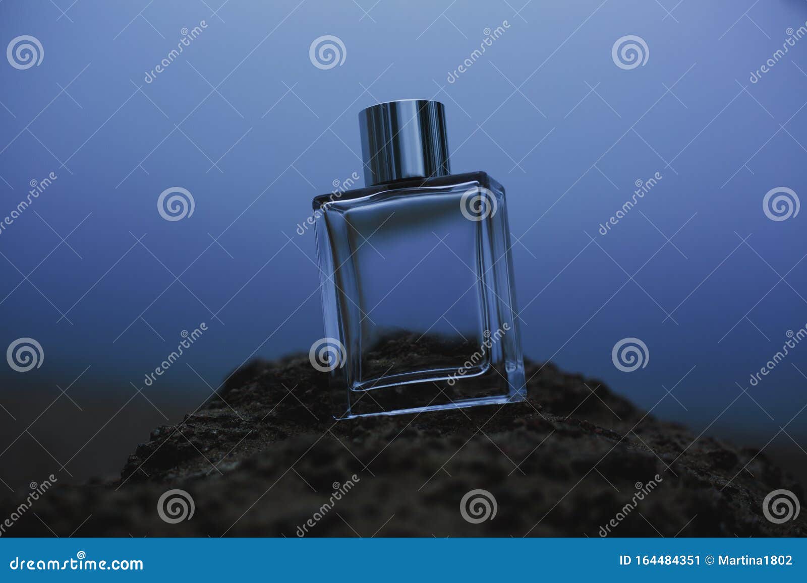 Perfume Bottle on Blue Nature Background Stock Image - Image of bottle